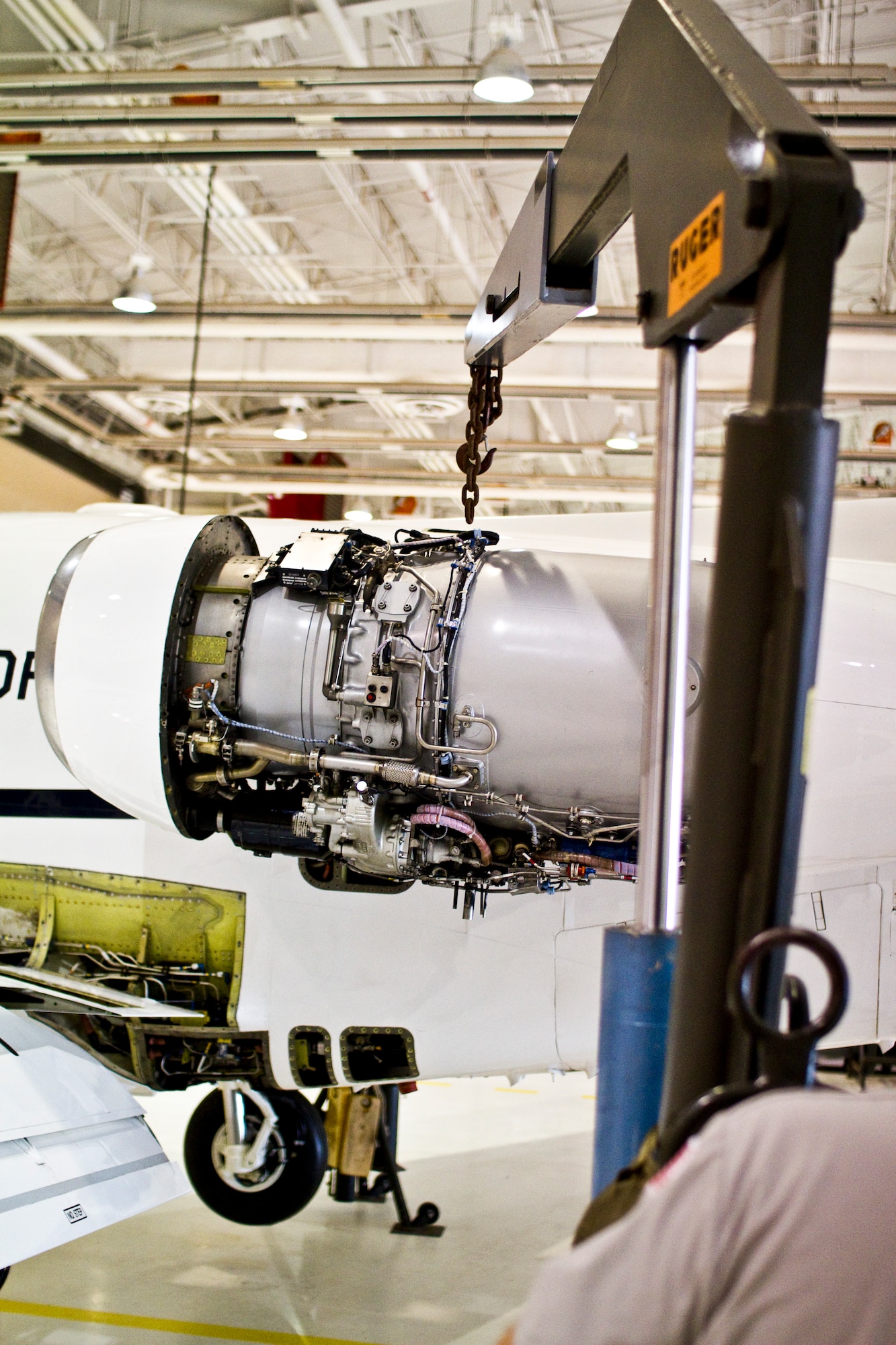 An uncovered T-1A Jayhawk engine with an engine hoist replicates the position of a failing hoist and falling engine Dec. 1 during a routine engine removal. (U.S. Air Force photo/2nd Lt. Paul Whittaker)
