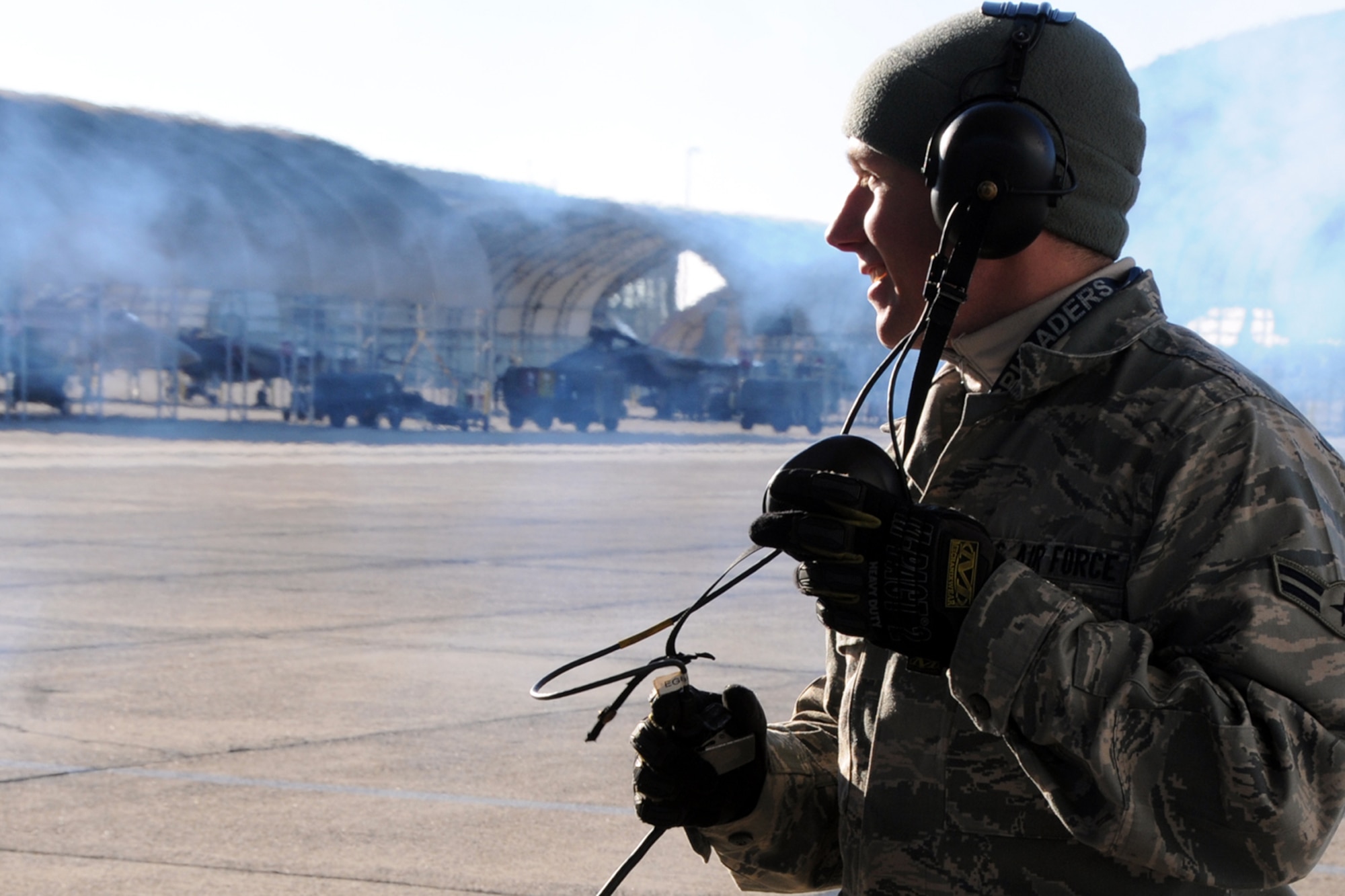 EGLIN AIR FORCE BASE, Fla. -- Airman 1st Class Travis Young, 46th Aircraft Maintenance Squadron, observes an F-16’s engine fire up before it taxis to the runway. Northwest Florida was hit by a massive cold front sending temperatures plummeting well below freezing. Despite the cold, the maintainers must prepare the jets and get them in the air. (U.S. Air Force photo/Airman 1st Class Anthony Jennings)