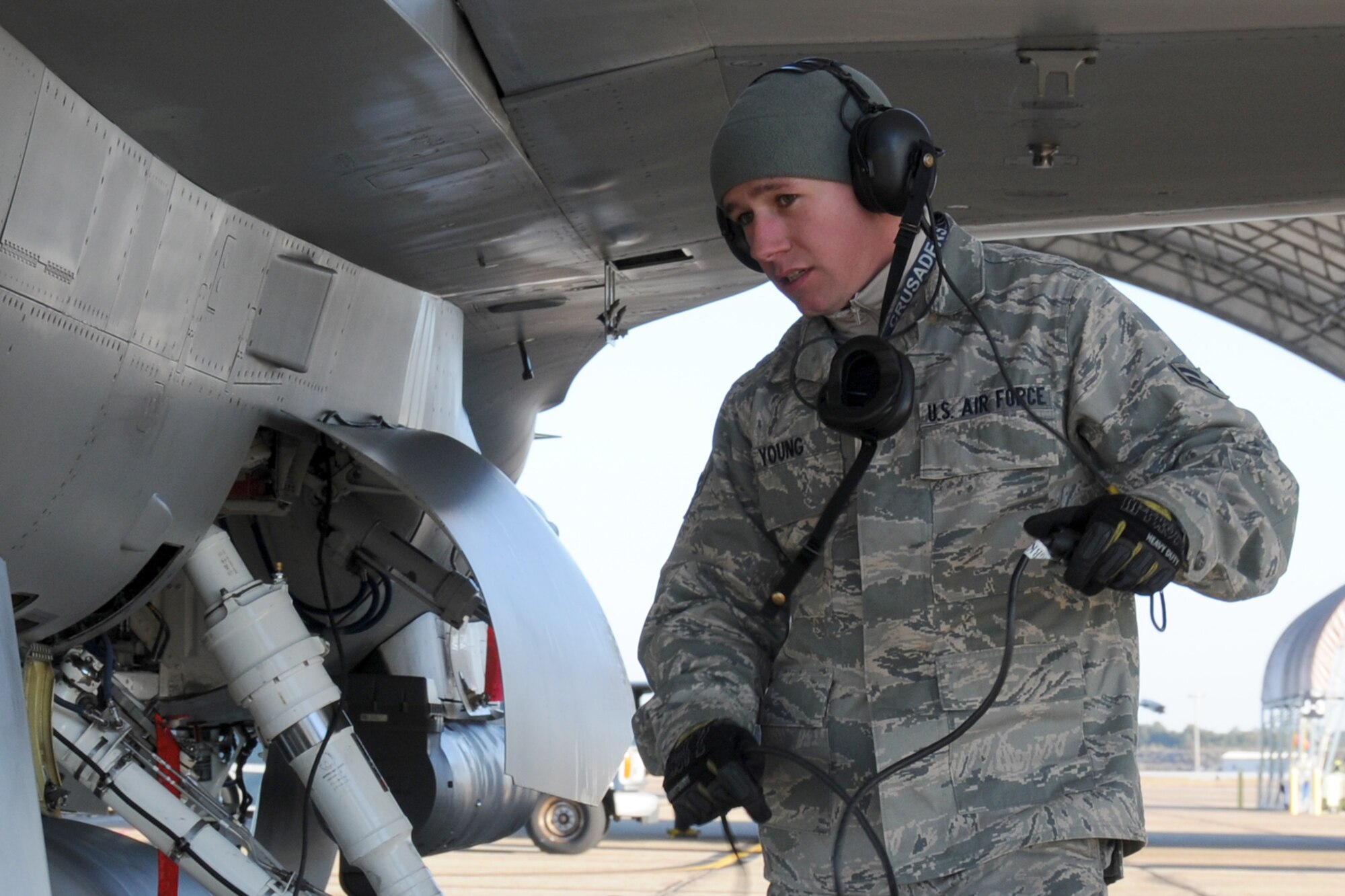 EGLIN AIR FORCE BASE, Fla. –Airman 1st Class Travis Young, 46th Aircraft Maintenance Squadron, checks an F-16’s landing gear before it taxis to the runway. Northwest Florida was hit by a massive cold front sending temperatures plummeting well below freezing. Despite the cold, the maintainers must prepare the jets and get them in the air. (U.S. Air Force photo/Airman 1st Class Anthony Jennings)