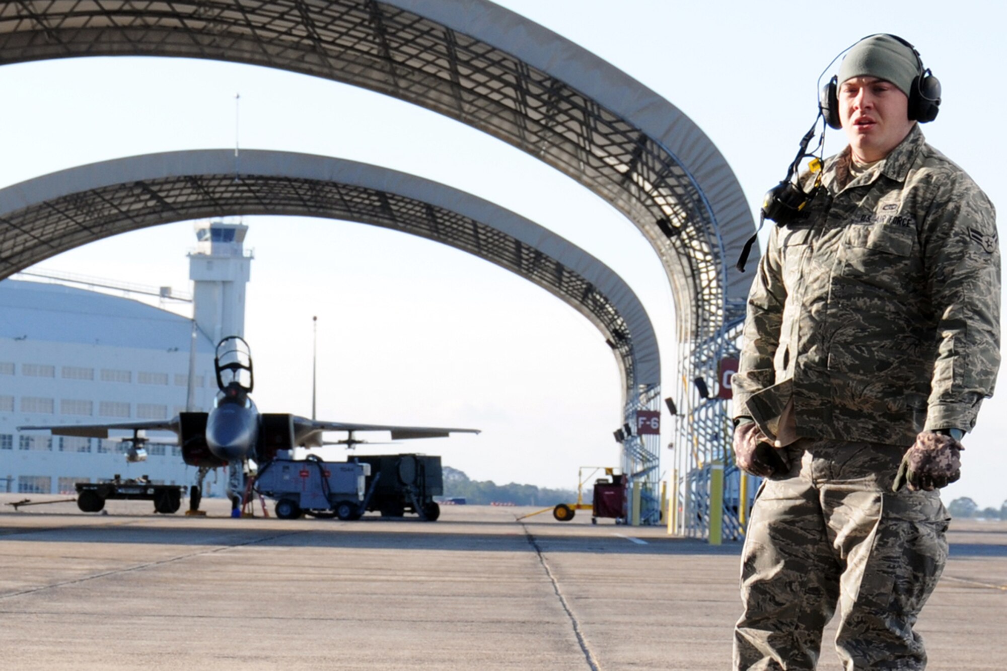 EGLIN AIR FORCE BASE, Fla. – Airman 1st Class Cody Snodgrass, 46th Aircraft Maintenance Squadron, waits for an F-16’s engine to fire up before it taxis to the runway. Northwest Florida was hit by a massive cold front sending temperatures plummeting below freezing. Despite the cold, the maintainers must prepare the jets and get them in the air. (U.S. Air Force photo/Airman 1st Class Anthony Jennings)