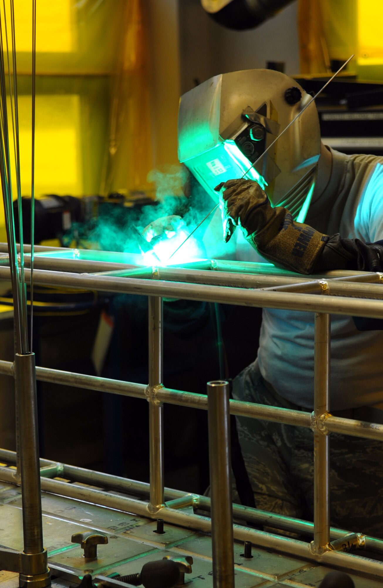 U.S. Air Force Airman 1st Class Michael Prox, 86th Maintenance Squadron metals technology fabrication journeyman, welds a life support structure for a C-130J Model aircraft, Ramstein Air Base, Germany, Dec. 30, 2009. The Metals Fabrication flight can manufacture and heat treat any metal part that is needed to properly maintain aircraft and equipment that cannot be produced or acquired. (U.S. Air Force photo by Airman 1st Class Caleb Pierce)