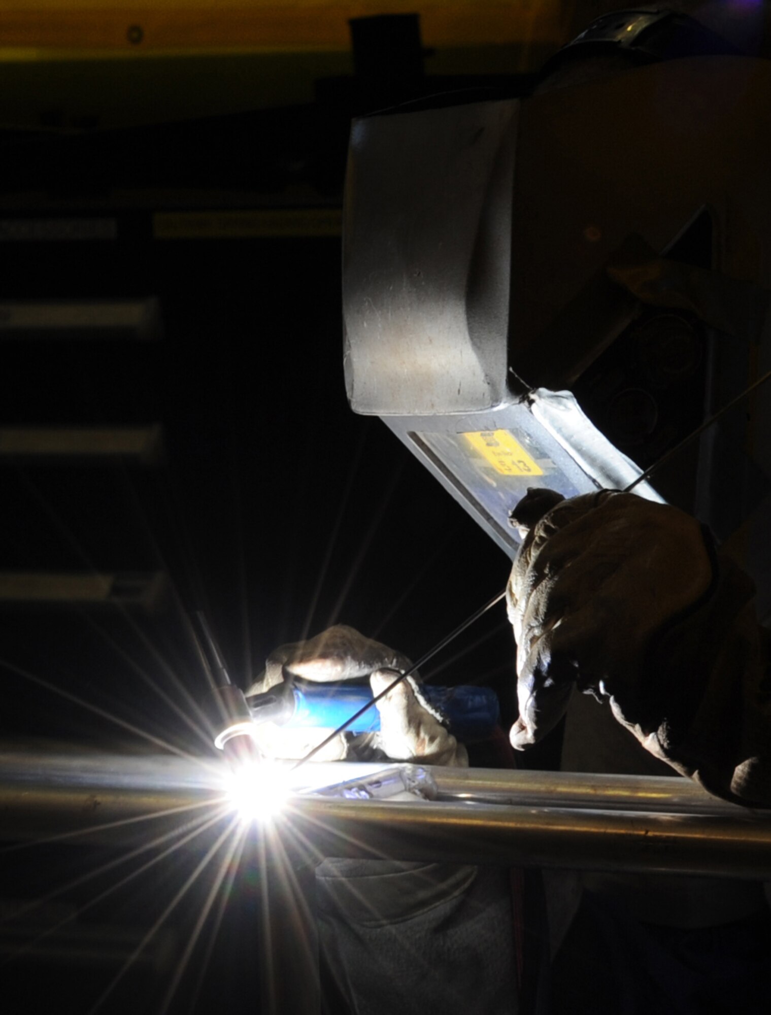 U.S. Air Force Airman 1st Class Michael Prox, 86th Maintenance Squadron metals technology fabrication journeyman, welds a life support structure for a C-130J Model aircraft, Ramstein Air Base, Germany, Dec. 30, 2009. The Metals Fabrication flight can manufacture and heat treat any metal part that is needed to properly maintain aircraft and equipment that cannot be produced or acquired. (U.S. Air Force photo by Airman 1st Class Caleb Pierce)