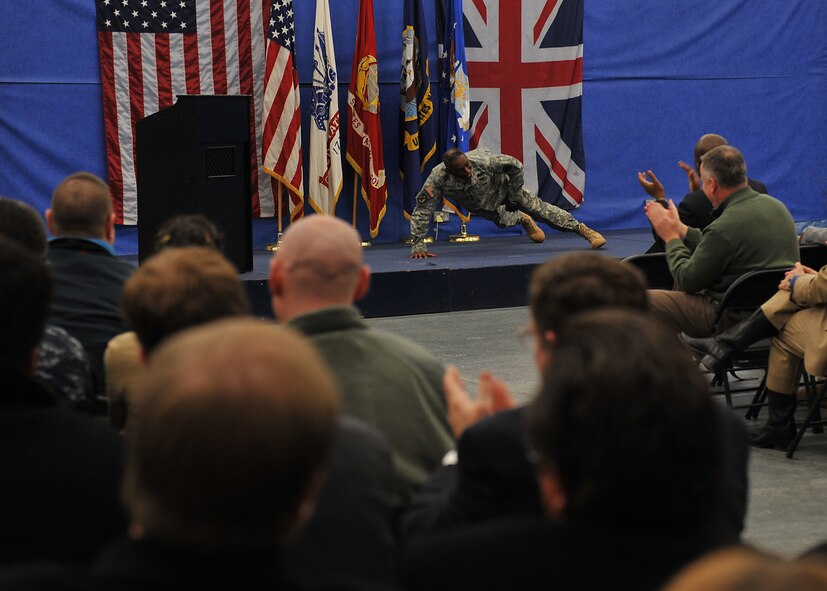 United States Army General William E. “Kip” Ward shows the Intelligence Knowledge Development Molesworth team how to get a good workout without a fitness center during an all hands on January 5, 2010.  (Photo by Air Force Staff Sgt. Javier Cruz)