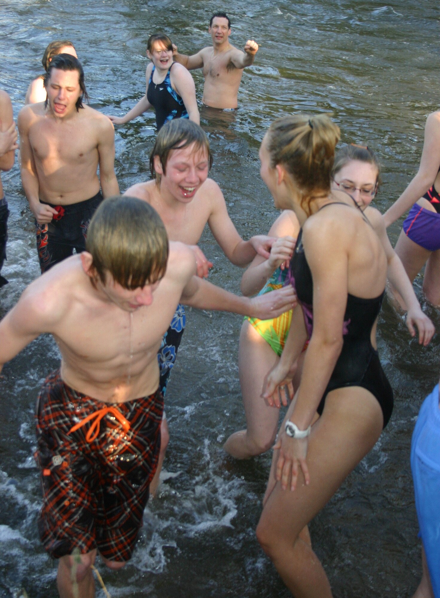 Members of the Barracudas Swim Team rush to exit the freezing cold water of the Little Ouse River in Santon Downham, Suffolk, Jan. 1, after their annual New Year’s Day plunge.  With the outside temperature only 27 degrees Fahrenheit, 24 people, both team members and their parents, braved the icy waters as part of team’s New Year’s Day tradition.  The Barracudas are part of the European Forces Swim League, which consists of elementary through high-school age swimmers from RAFs Lakenheath and Mildenhall.  The team competes against teams from across Europe.