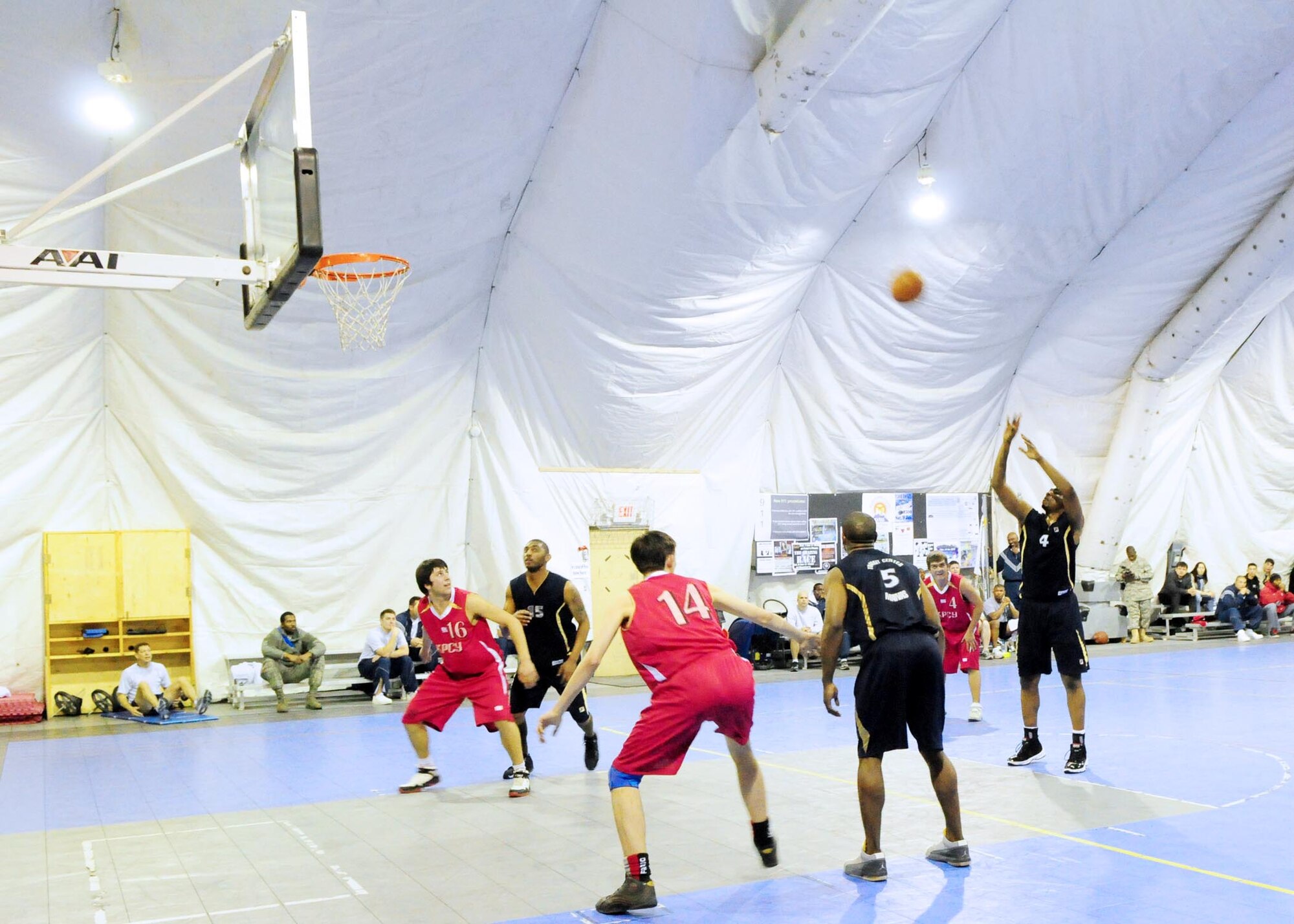 Transit Center at Manas basketball team center, Edward Moore, shoots a free throw during a friendly game here Jan. 5. The Manas team defeated students from the Kyrgyz Russian Slavic University 93-51. Moore is a civilian land mobile radio technician with the 376th Expeditionary Communications Squadron. (U.S. Air Force photo by Senior Master Sgt. Mike Litsey)