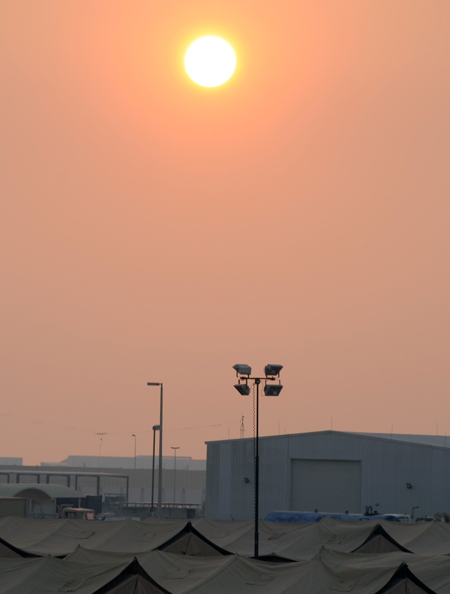 The sun sets Jan. 5, 2009, over the 380th Air Expeditionary Wing camp at a non-disclosed location in Southwest Asia.  The 380th AEW is comprised of four groups and 12 squadrons and the wing?s deployed mission includes air refueling, surveillance, and reconnaissance in support of overseas contingency operations in Southwest Asia. (U.S. Air Force Photo/Tech. Sgt. Scott T. Sturkol/Released)
