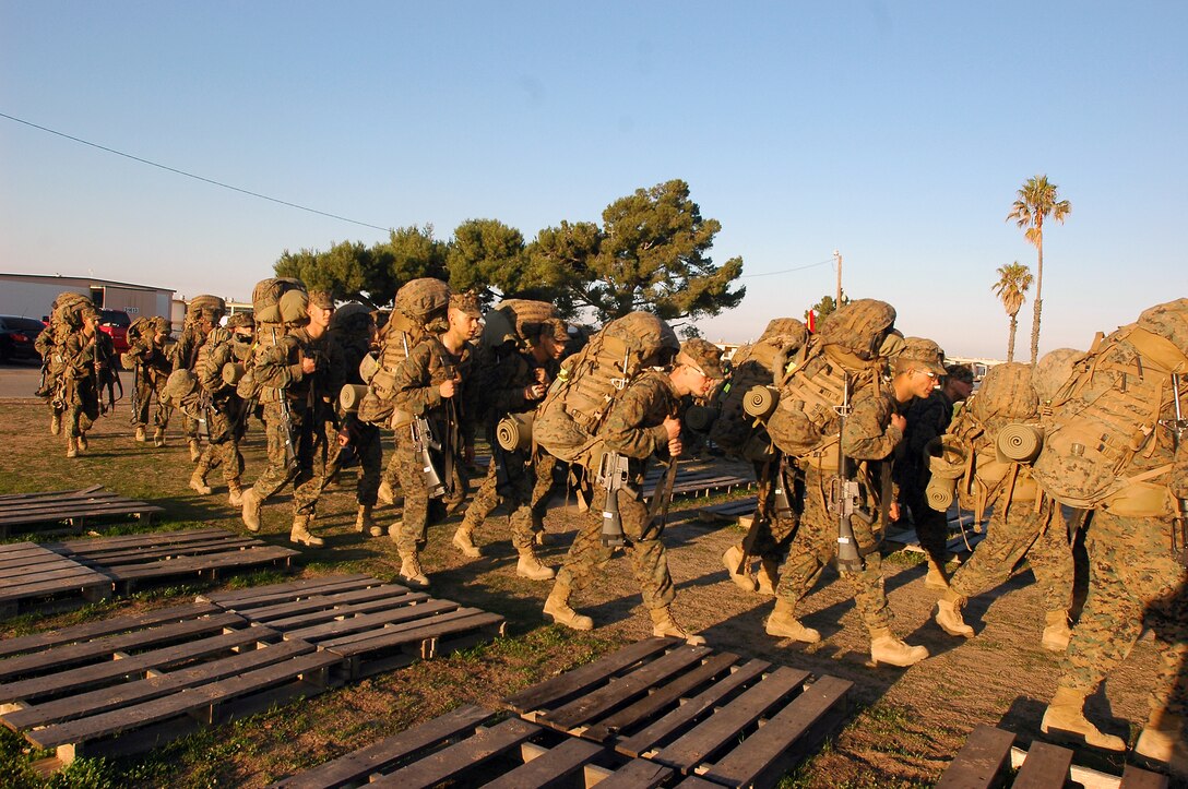 Recruits finish the final lengths of their last hike during recruit training, where they will soon march onto the parade deck at Edson Range, Marine Corps Base Camp Pendleton, Calif., and be awarded their eagle, globe and anchor and earn the title, Marine, Jan. 7, 2010.