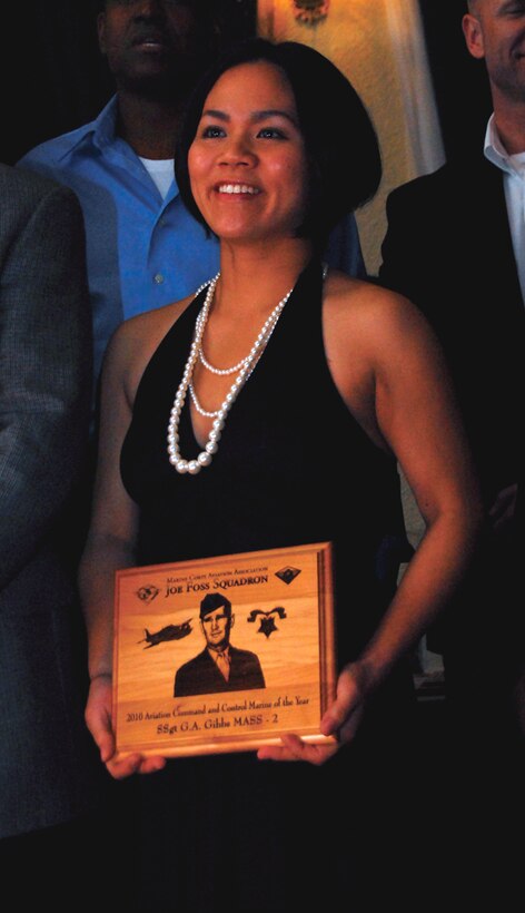 Takako Gibbs accepted the Marine Corps Aviation Association nomination for the 1st Marine Aircraft Wing, III Marine Expeditionary Force, Kenneth A. Innis Aviation Command and Control Marine award of the year for her husband, Staff Sgt. John Gibbs, who is currently deployed to Iraq.