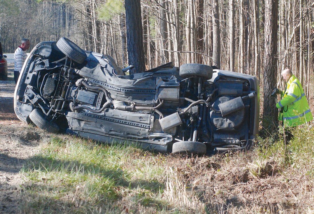 Personnel from Cherry Point, Havelock and Township Six are shown around the wrecked Lexus on Catfish Lake Road Thursday morning. A brother and sister were injured in the single-vehicle crash.