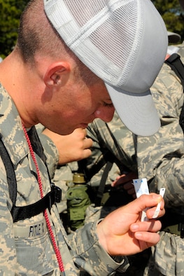 Air Force Academy Cadet 4th Class Kyle Fitle checks his temperature using a disposable thermometer during Basic Cadet Training at the Academy's Jacks Valley July 13, 2009. The cadet population was screened for influenza-like symptoms after more than 150 cadets were diagnosed with the H1N1 flu virus. (U.S. Air Force photo/Dave Ahlschwede)
