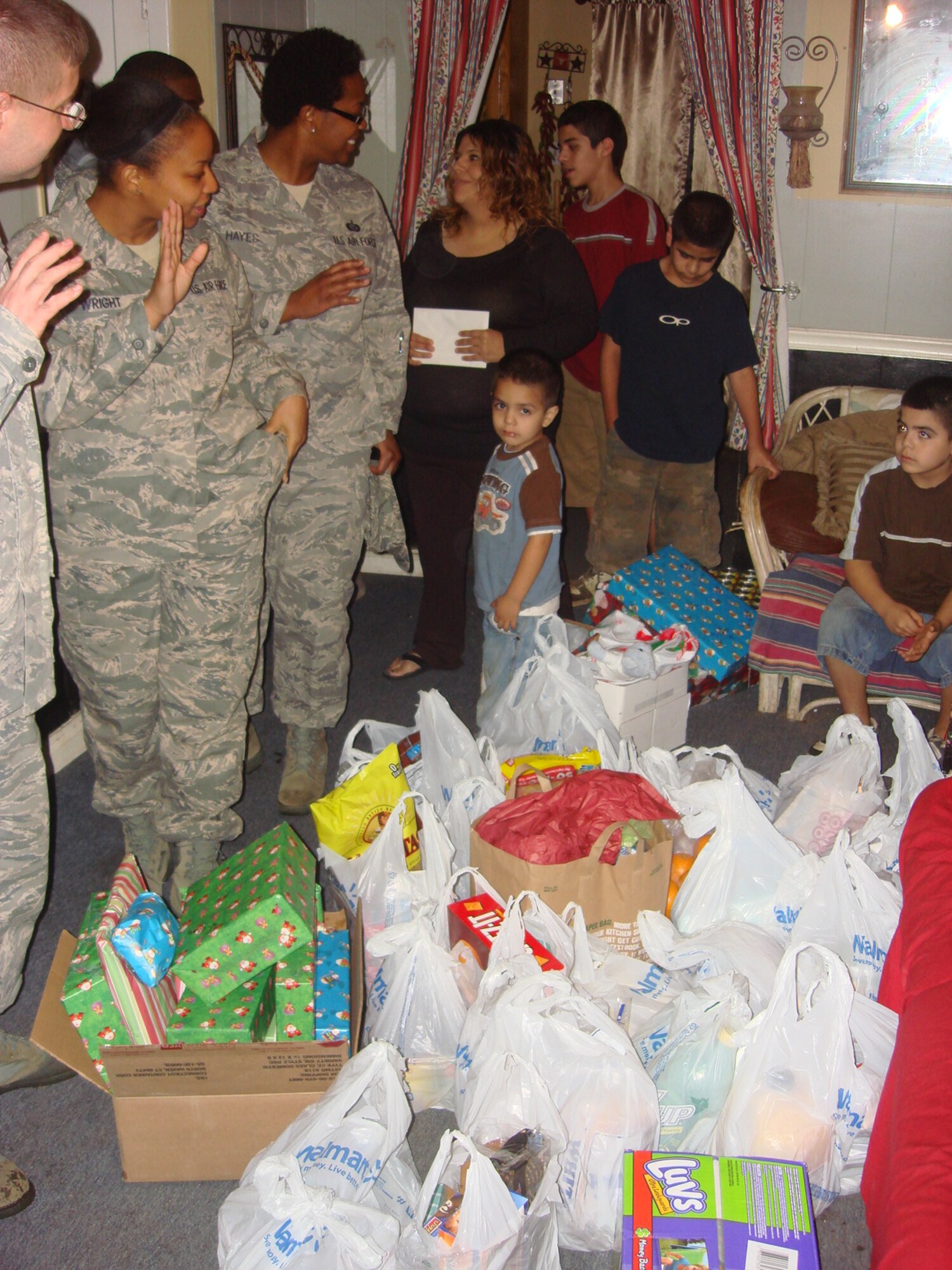 Santa’s helpers from the 602nd TRG (P) say goodbye after delivering food and gifts.  (Courtesy Photo)