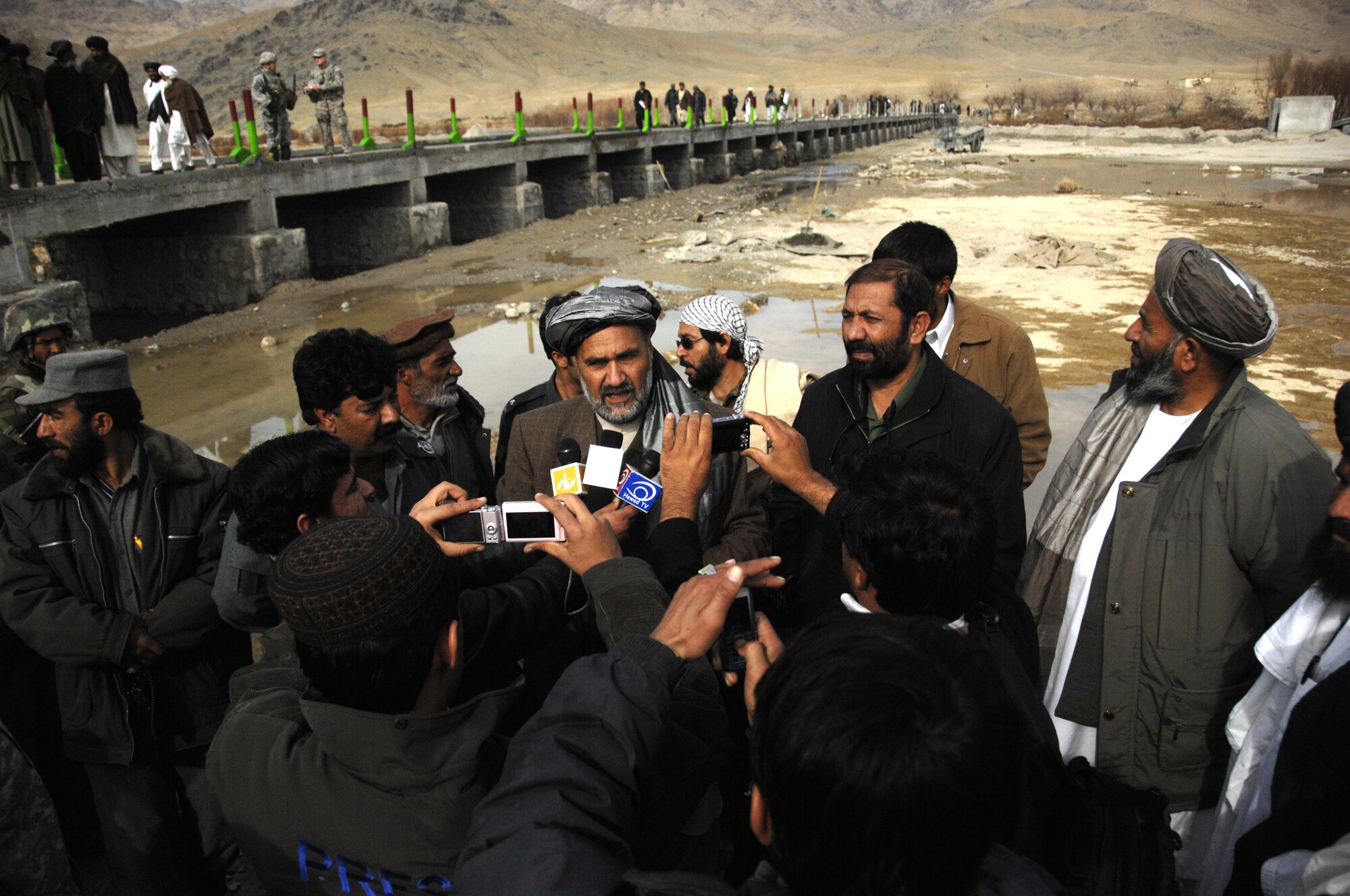 Zabul Provincial Governor Mohammad Ashraf Naseri answers questions from the Afghan media and explains the importance of the Arghandab Bridge Dec. 26, 2009, at Zabul Province, Afghanistan. This bridge provides access to the northern part of the province, allowing people to transport food and supplies during winter months as water levels are high during that season. (U.S. Air Force photo/Senior Airman Timothy Taylor)