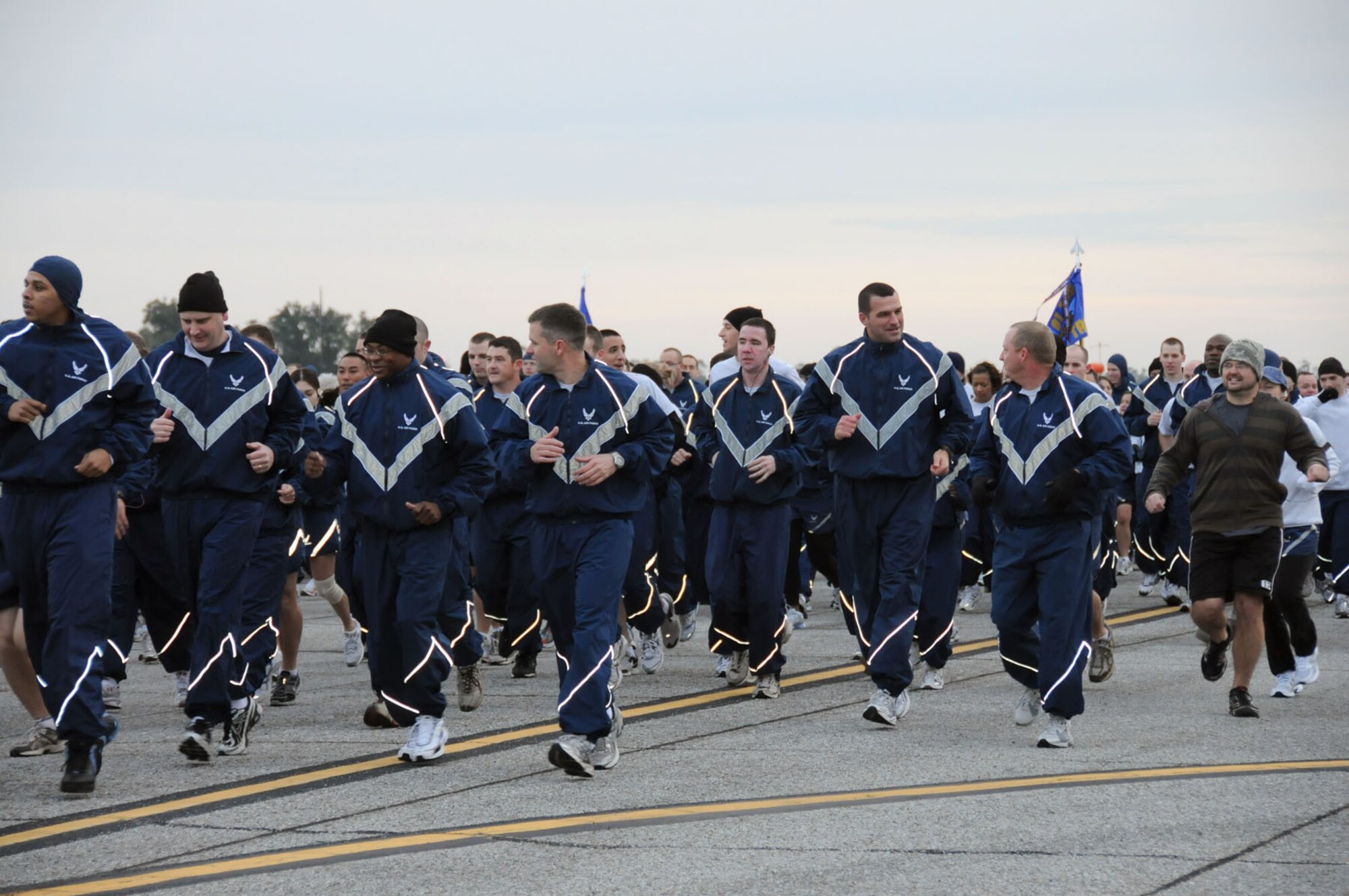 Airmen engaged in a morning run on the flightline and other team-building activities for the Wingman Day observance.  With the slogans “Promoting Resilience” and “Reducing Stigma,” the purpose ot the event was to remind Airman to take care of each other during the holiday season.  (U.S. Air Force photo by Kemberly Groue)