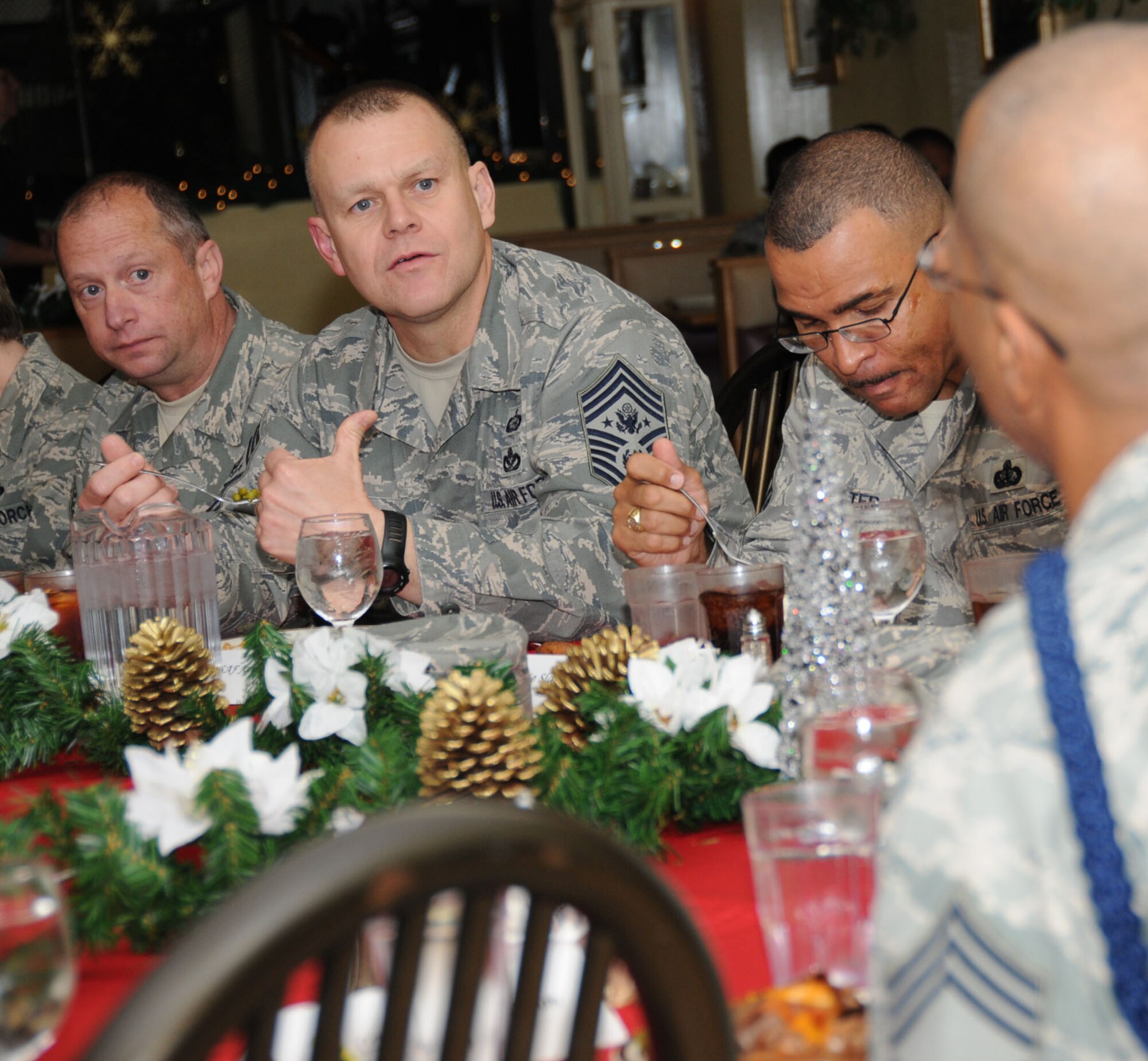 From left, Chief Master Sgts. Anthony Woitalla, Roy, Lonnie Slater and Malcolm Golson talk during the Keesler Chiefs Group luncheon Dec. 17.  Chief Woitalla is the 403rd Wing command chief, Chief Slater is the 81st Training Wing command chief and Chief Golson is assigned to 2nd Air Force.  (U.S. Air Force photo by Kemberly Groue)