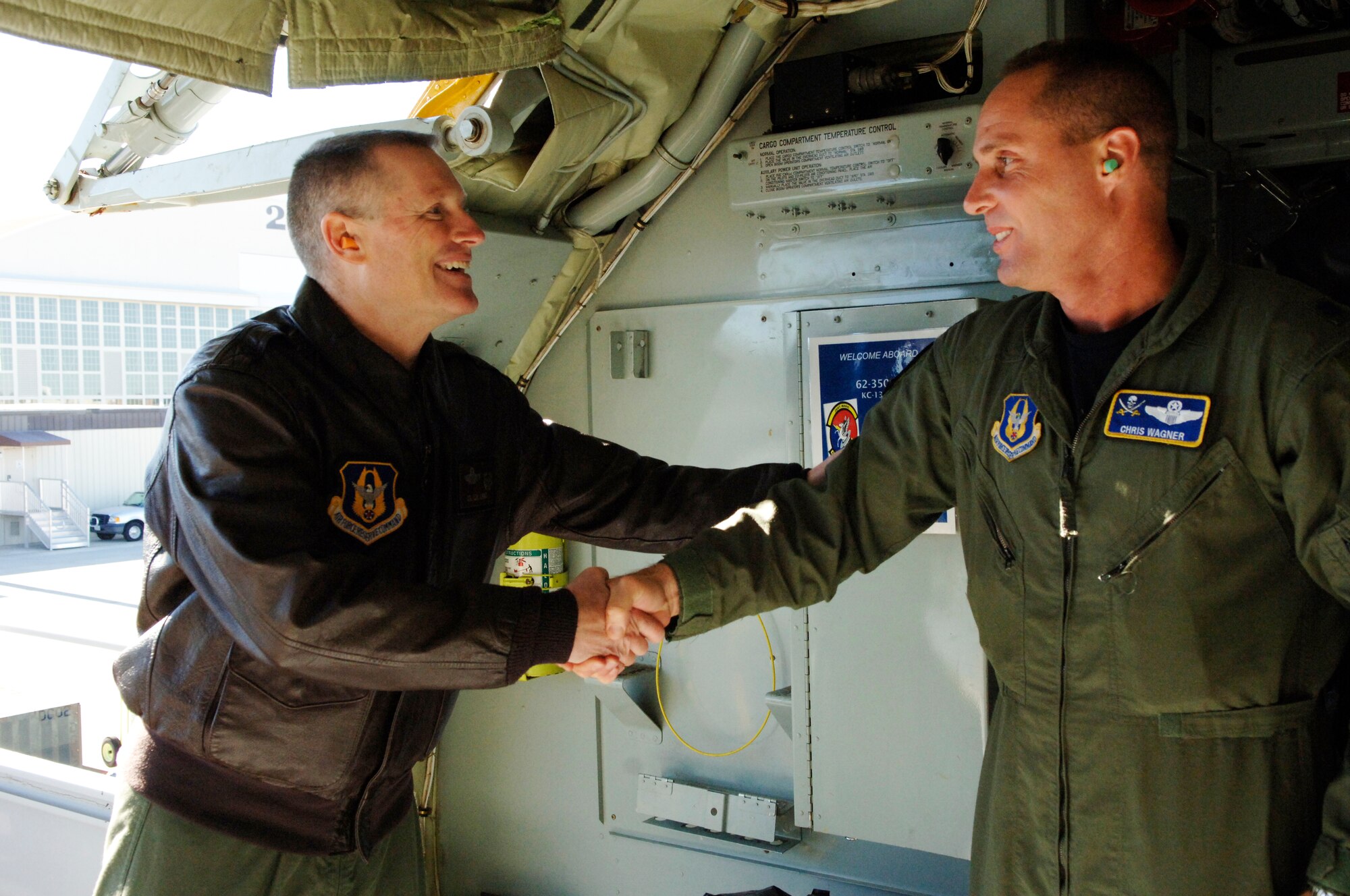 Col Kenneth D. Lewis, Jr, Commander of the 927th Air Refueling Wing, welcomes home Lt. Col. Chris Wagner, the Deputy Group Commander of the 927th Operations Group. Wagner  was deployed to Guam for 60 days in support of Operation Enduring Freedom. (U.S. Air Force photo/Tech Sgt. Denise Hauser)