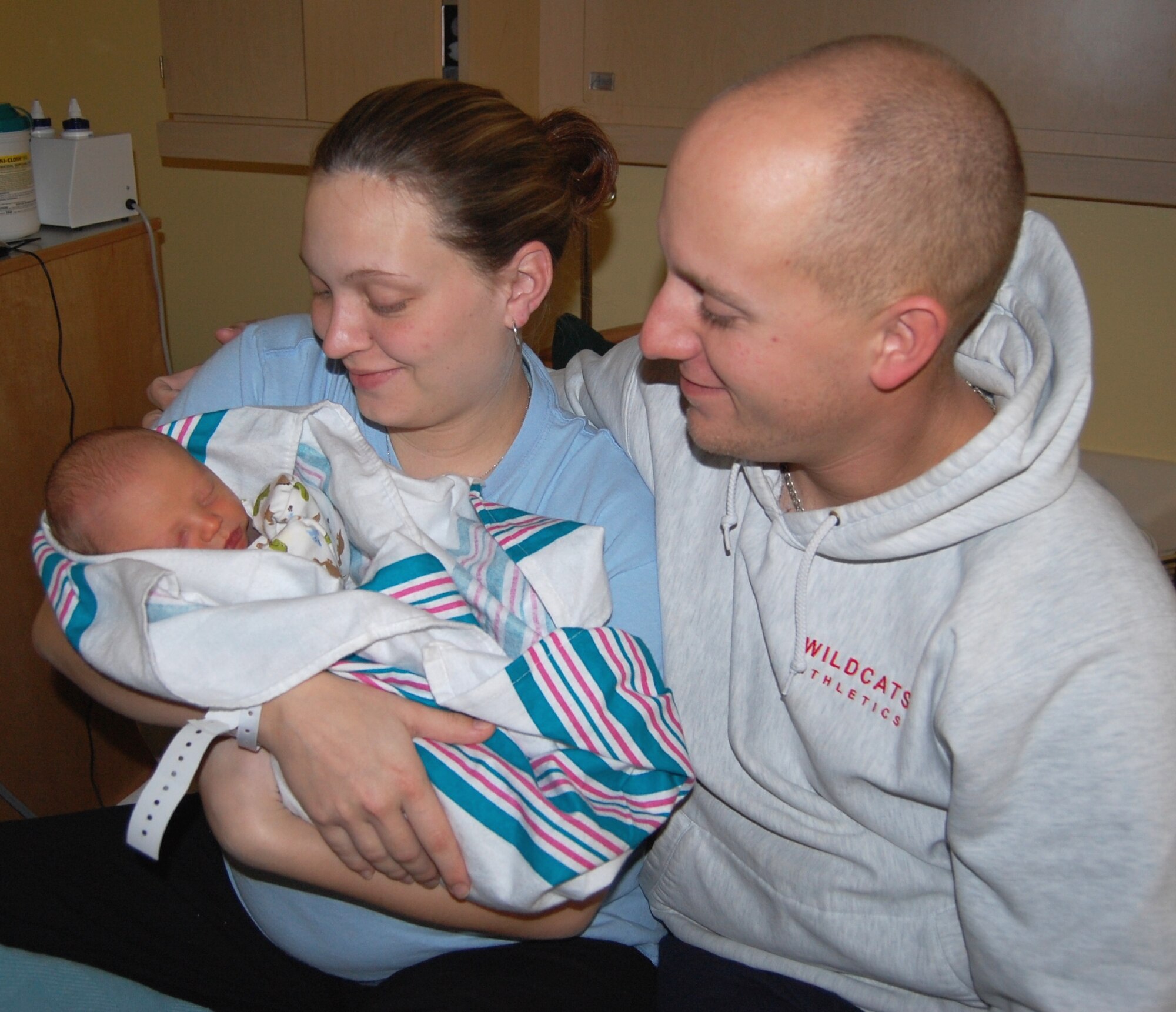 Venessa and Petty Officer 2nd Class Tylor Blasko admire their son Eli Jan. 5 in Keesler Medical Center’s family birthing center.  Eli, born 11:48 p.m. Sunday, is Keesler’s first baby for 2010 and the couple’s first child.  Eli weighed 8 pounds, 1 ounce and was 20 inches long.  Petty Officer Blasko has been assigned to the Naval Construction Battalion Center in Gulfport for five years.  The couple is from Elmira, Mich., and resides in McHenry, Miss.  (U.S. Air Force photo by Steve Pivnick)