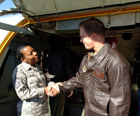 Command Chief Master Sgt. Nina Watkins of the 927th Air Refueling Wing welcomes home Tech.Sgt. Matt Janson, a boom operator with the 63rd Air Refueling Squadron.  Janson was deployed to Guam for 60 days in support of Operation Enduring Freedom. (U.S. Air Force photo/Tech Sgt. Denise Hauser)