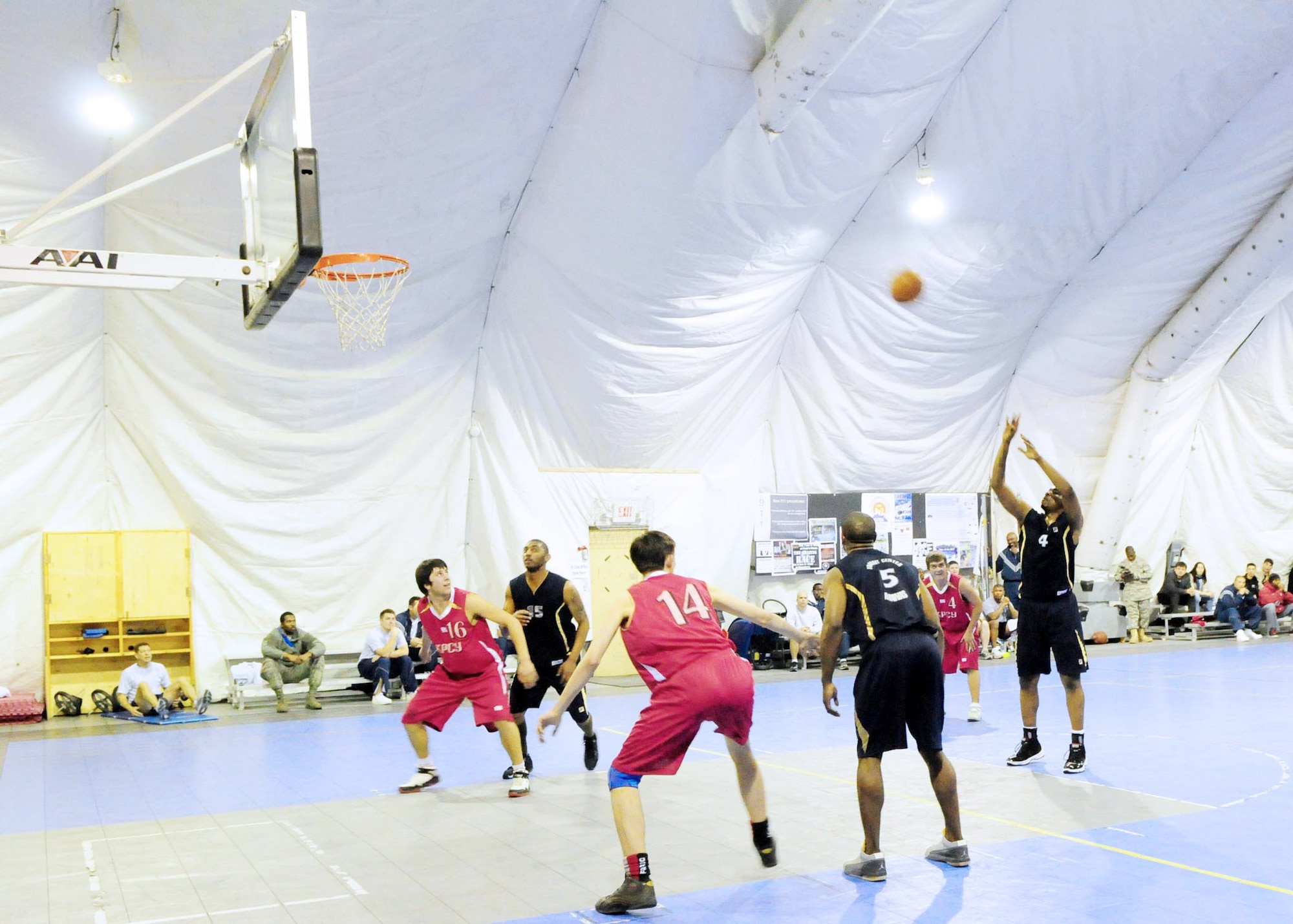 Edward Moore shoots a free throw during a basketball game Jan. 5, 2010, at the Transit Center at Manas. The Transit Center team defeated students from the Kyrgyz Russian Slavic University, 93-51. Moore is a center on the Transit Center at Manas basketball team. Moore is a civilian land mobile radio technician with the 376th Expeditionary Communications Squadron. (U.S. Air Force photo/Senior Master Sgt. Mike Litsey)