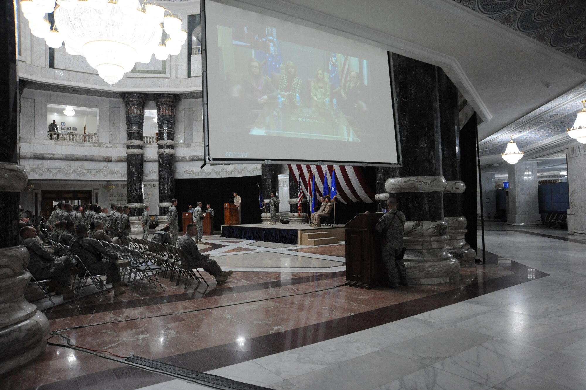 Air Force Brig. Gen. Scott Hanson's family in the U.S. watches the change of command ceremony in Al Faw Palace on Victory Base Complex, Baghdad, via video feed Jan. 7, 2010. General Hanson assumed command of the 321st Air Expeditionary Wing. The wing's mission is to train and advise the Iraqi air force in order to advance the foundational airpower capabilities of Iraqi Airmen. (U.S. Air Force photo/Master Sgt. Trish Bunting/Released)