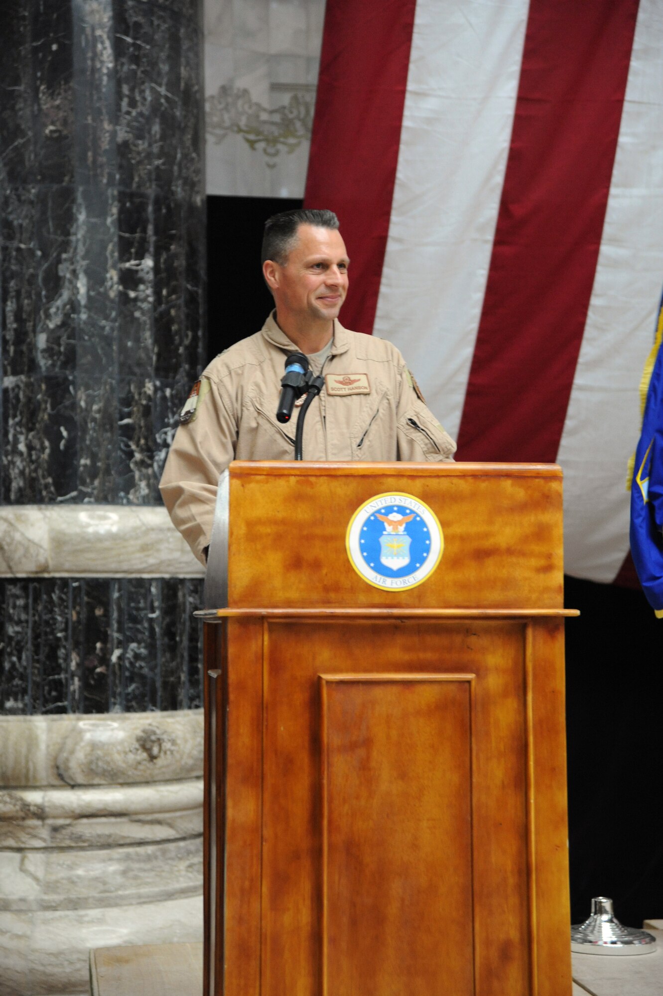 Air Force Brig. Gen. Scott Hanson, new commander of the 321st Air Expeditionary Wing, addresses the audience during the change of command ceremony in Al Faw Palace on Victory Base Complex, Baghdad, Jan. 7, 2010. The mission of the 321st AEW is to train and advise the Iraqi air force in order to advance the foundational airpower capabilities of Iraqi Airmen. (U.S. Air Force photo/Master Sgt. Trish Bunting/Released)