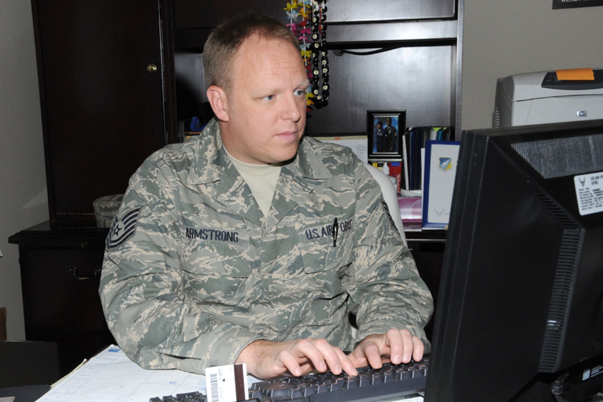 Tech. Sgt. Charles Armstrong, Command Staff Support, 916th ARW/CCA, checks email during a unit training assembly at Seymour Johnson AFB, N.C.  (U.S. Air Force photo by Tech. Sgt. Gillian M. Albro, 916th ARW/PA)
