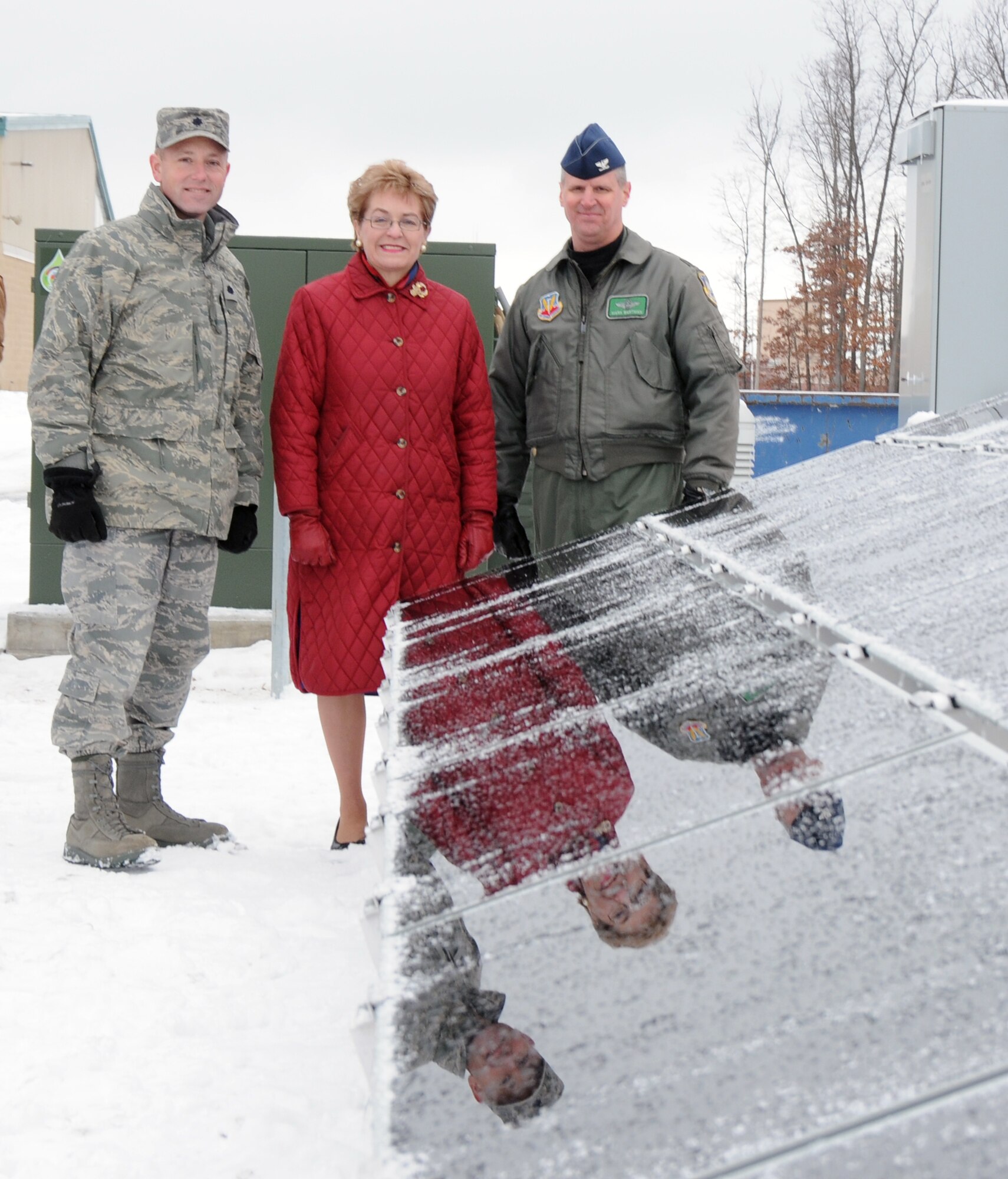 Lt.Col. William Giezie, 180th Fighter Wing Civil Engineering Squadron Commander, Congresswoman Marcy Kaptur from Ohio's Ninth Congressional District, and Col. Mark Bartman 180th Fighter Wing Commander paused for a photo during a press conference at the 180th Fighter Wing Air National Guard Base at Toledo Express Airport. The 180th hosted a press conference on 5 January, announcing further expansion of its highly successful alternative energy solar field. The solar field, set for completion October 2010, is part of the 180th FWs Renewable Energy Project funded by the Department of Defense Research and Development Program in an effort to reduce the use of limited fossil fuel sources and dependence on foreign energy sources. Once completed, the solar field is expected to produce 800-900 kilowatts of electricity, allowing the 180th to save approximately 37.5% on the annual electricity budget, reduce the amount of coal burned to almost 250 tons annually and at the same time, reduce harmful emissions and greenhouse gasses. USAF Photo by SrA Jodi Leininger (Released).