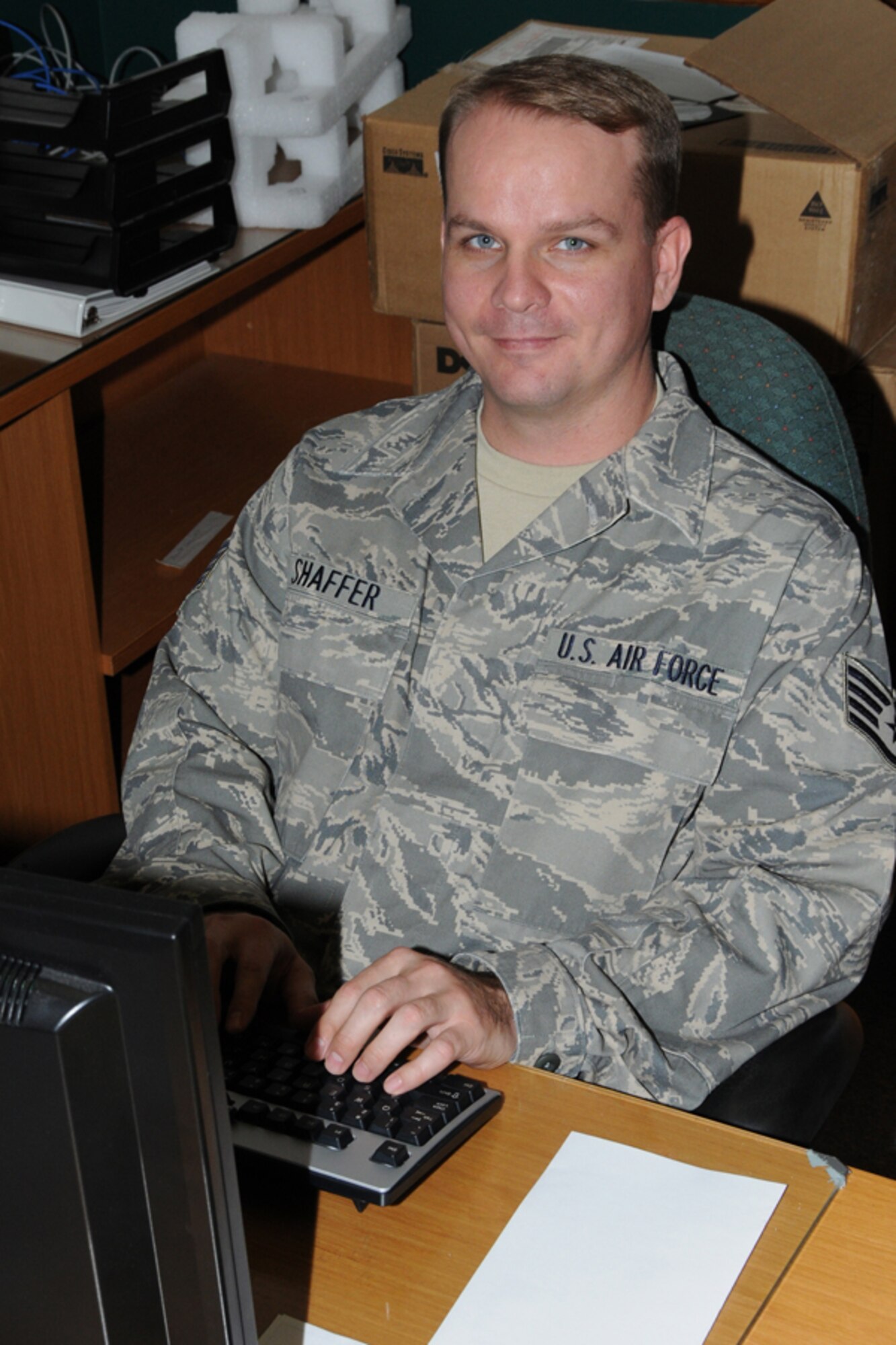 Staff Sgt. Richard Shaffer, knowledge operations manager, 916th Operations Group, answers emails during a unit training assembly.  (U.S. Air Force photo by Tech. Sgt. Gillian M. Albro, 916th ARW/PA)