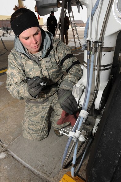 WHITEMAN AIR FORCE BASE, Mo. – Senior Airman Sabrina Bertz, 442nd A-10 Thunderbolt II crew chief, performs a flight inspection after an A-10 landed Jan. 6, 2010.  The 442nd Fighter Wing is an Air Force Reserve Command unit based here. (U.S. Air Force photo/Senior Airman Jessica Snow)