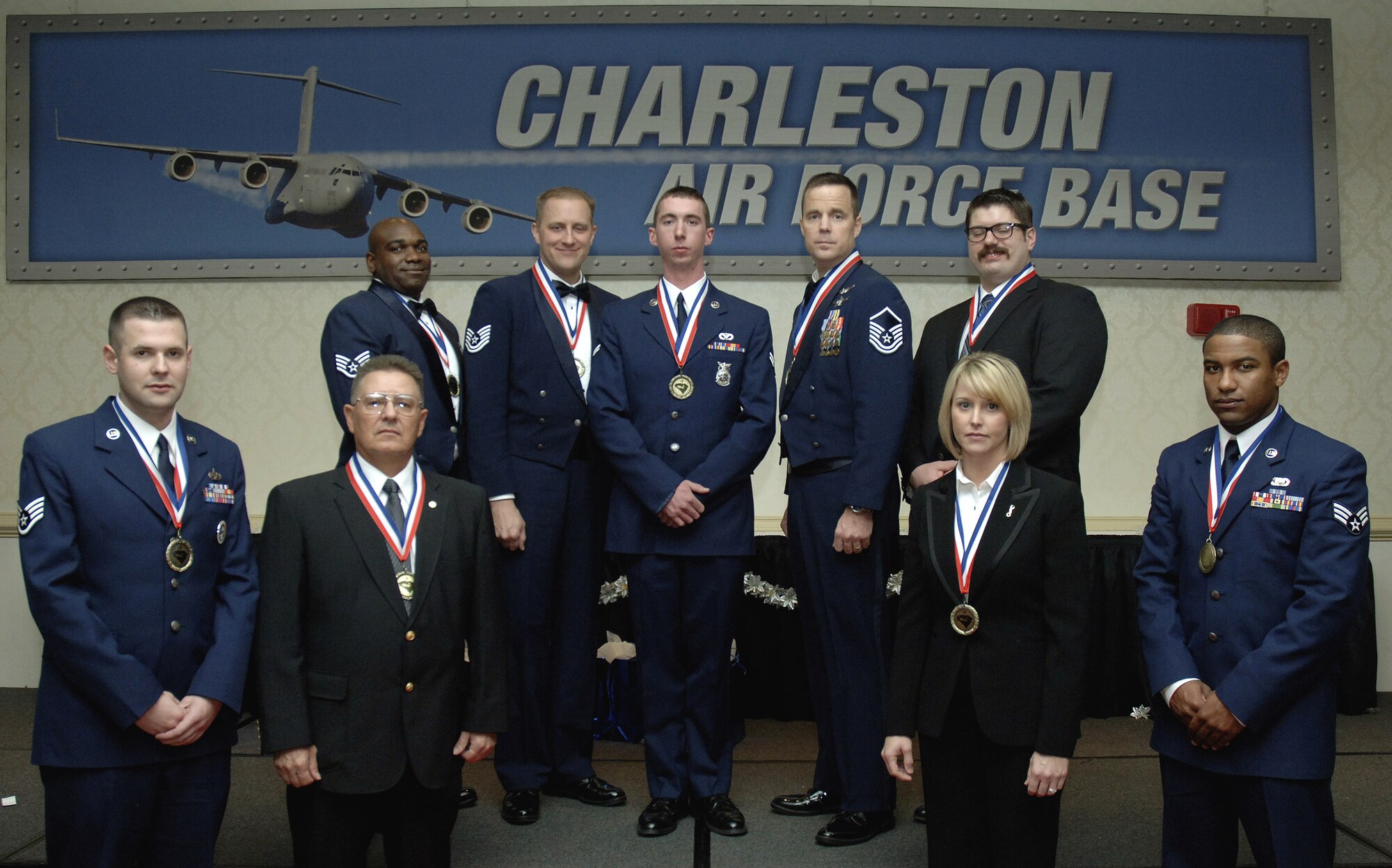The 2009 Annual Award winners gather for a photo at the conclusion of the Annual Awards Banquet held at the Charleston Club Jan. 6. A total of 12 awards were given based on individuals' exceptional performance and personal achievements throughout 2009. Three of the award recipients are currently deployed. (U.S. Air Force photo/Airman 1st Class Lauren Main)