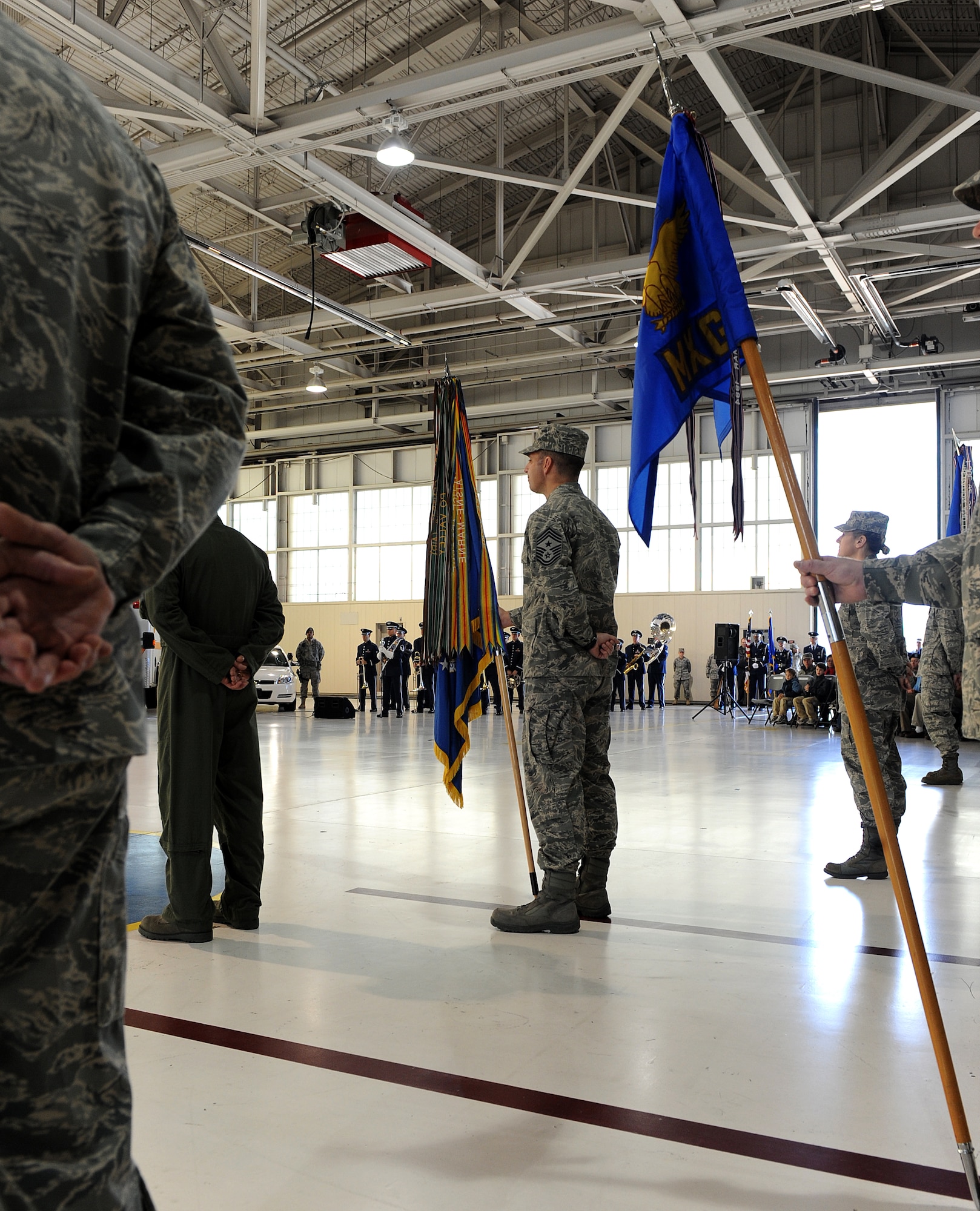 LANGLEY AIR FORCE BASE, Va. --  Command Chief Master Sgt. Kevin Jurgella, 1st Fighter Wing command chief, stands at parade rest with the 1st Fight Wing guidon during the 633d Air Base Wing activation and change-of-command ceremony.  The activation of the 633d ABW is the first step in fulfilling congress' 2005 Base Realignment and Closure decision that forms Joint Base Langley-Eustis later this month. (U.S. Air Force photo/Senior Airman Zachary Wolf) 
