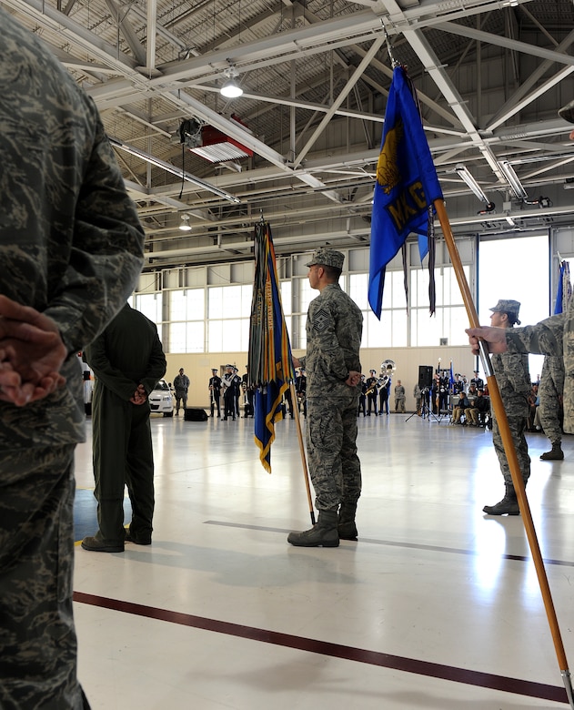 LANGLEY AIR FORCE BASE, Va. --  Command Chief Master Sgt. Kevin Jurgella, 1st Fighter Wing command chief, stands at parade rest with the 1st Fight Wing guidon during the 633d Air Base Wing activation and change-of-command ceremony.  The activation of the 633d ABW is the first step in fulfilling congress' 2005 Base Realignment and Closure decision that forms Joint Base Langley-Eustis later this month. (U.S. Air Force photo/Senior Airman Zachary Wolf) 
