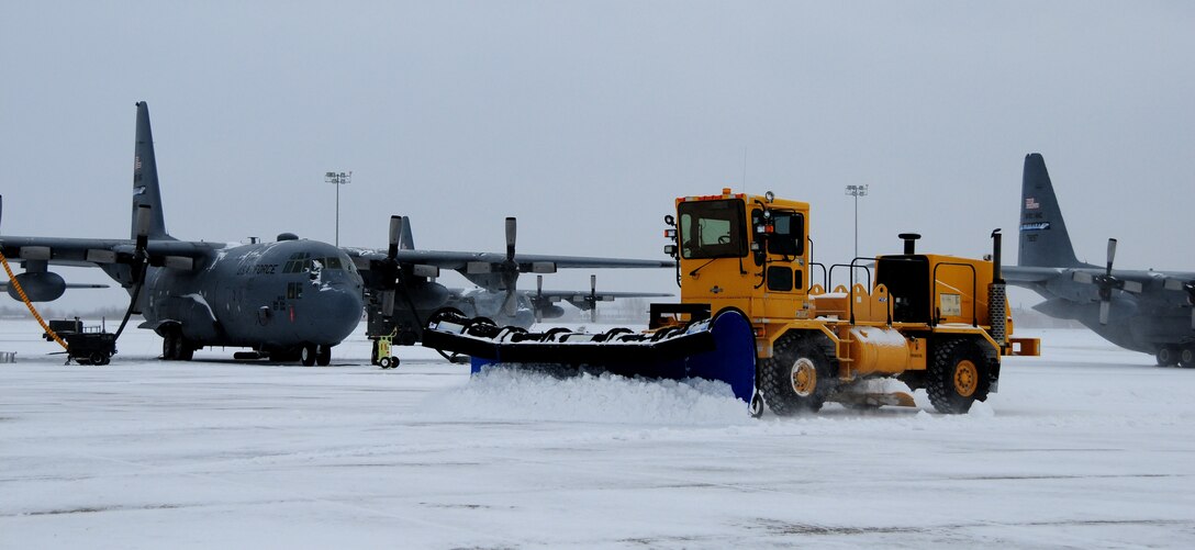 NIAGARA FALLS AIR RESERVE STATION, NY--Dan Woods, contractor, Satellite Service Inc., clears the apron to allow movement of mission essential air craft, January 6. Operation of the base depends greatly on the efficiency of snow removal teams. (U.S. Air Force photo by Staff Sgt Stephanie Clark) (Released)