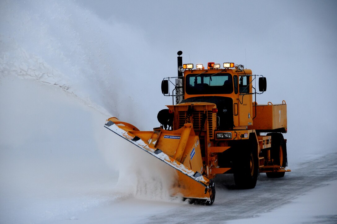 NIAGARA FALLS AIR RESERVE STATION, NY--A snow plow clears the flight line to allow movement of mission essential air craft, January 6. Operation of the base depends greatly on the efficiency of snow removal teams. (U.S. Air Force photo by Staff Sgt Stephanie Clark) (Released)   
