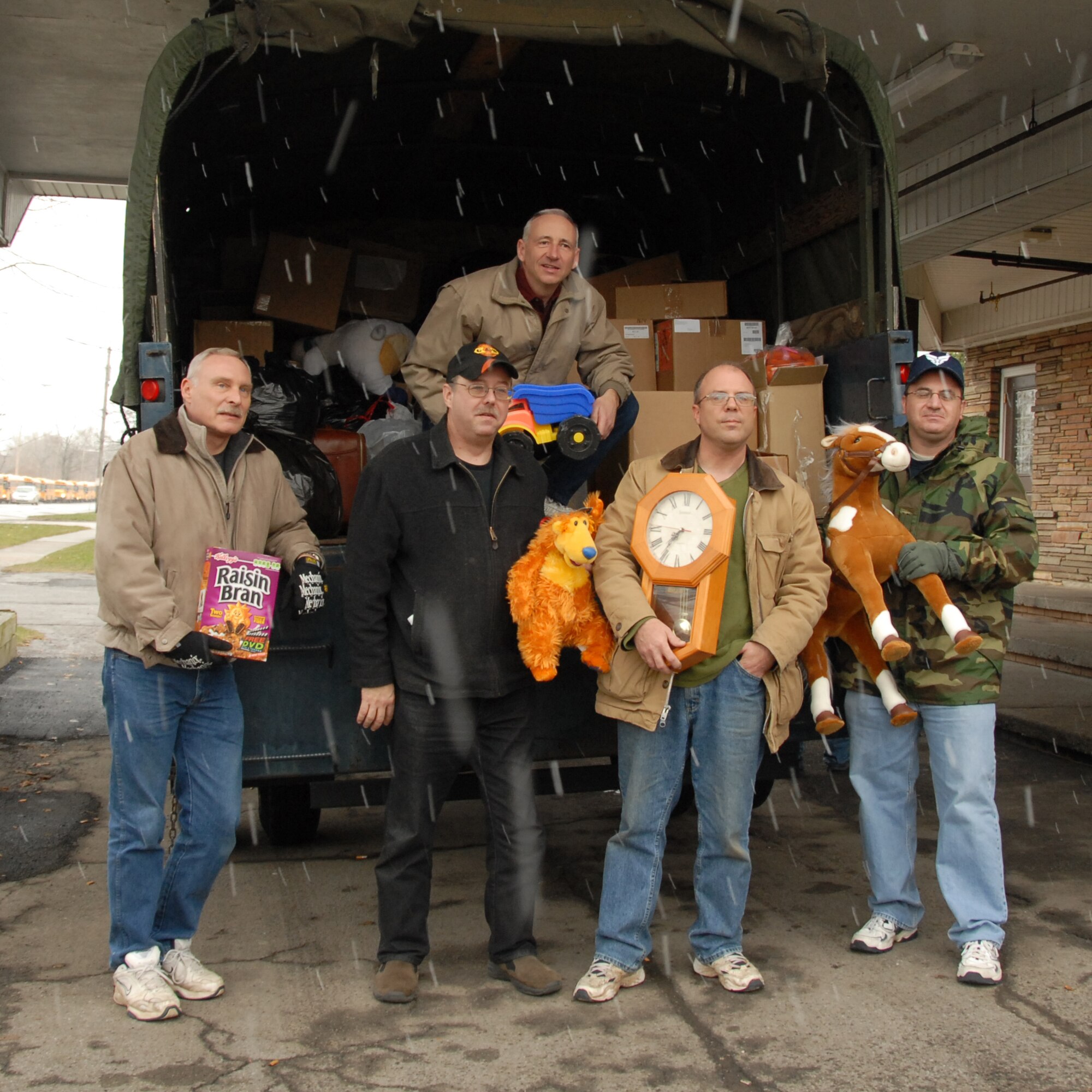 Members from the 107th Airlift Wing once again answered the call. For the 21st consecutive year members graciously donated countless bags of clothing, toys and food. (Left to right) Master Sgt. Duane Bores, Master Sgt. Mark Lewandowski, Tech. Sgt. Paul Wiegand, Master Sgt. Roger Clark and Master Sgt. Steven Buja up on truck. (U.S. Air Froce Photo/ Tech Sgt. Cathy Perretta) 