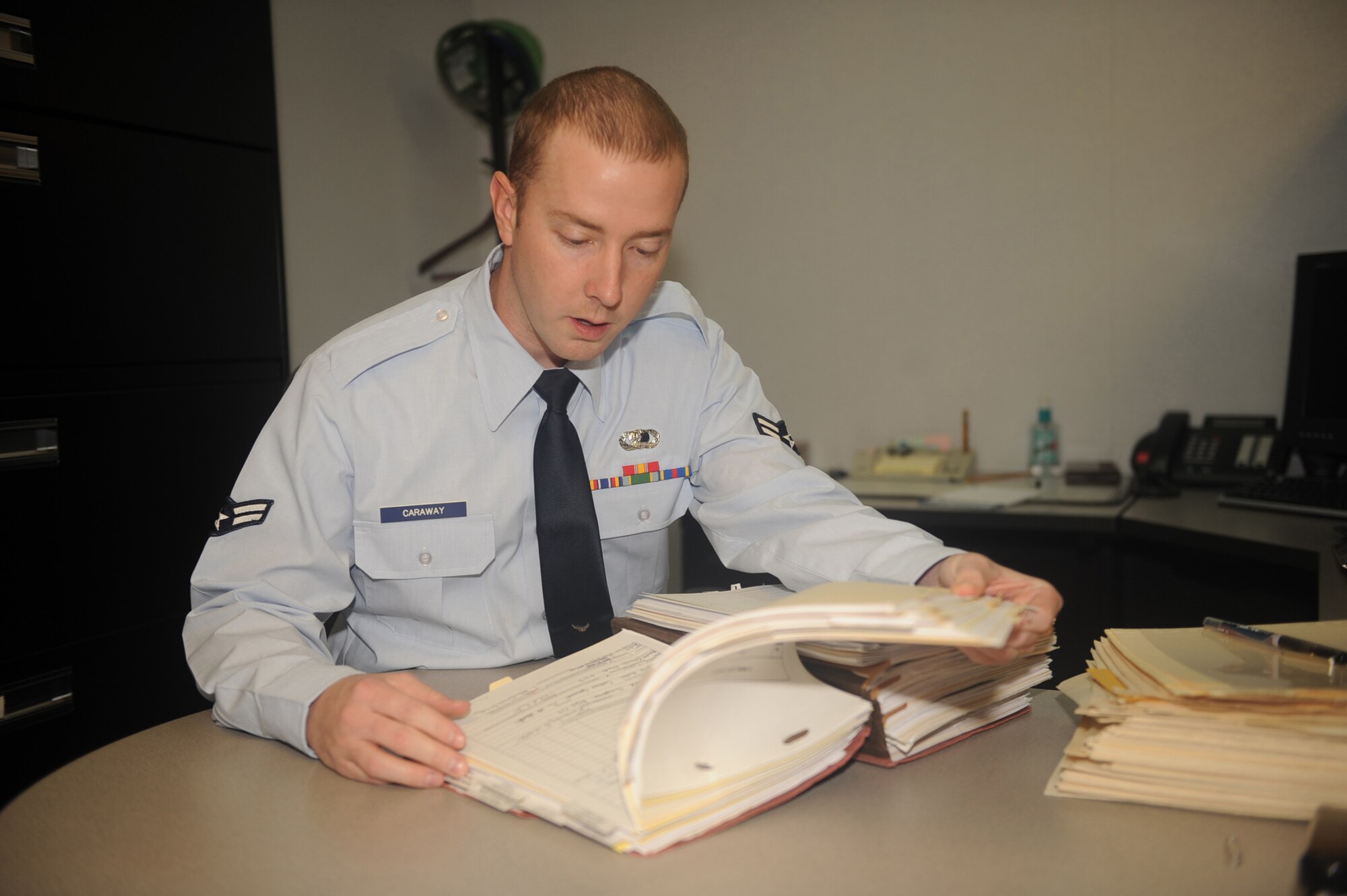 Airman 1st Class Aaron Caraway, 4th Contracting Squadron contracting specialist reviews a contract for discrepancies on Seymour Johnson Air Force Base, N.C., Jan 4, 2010. Reviews ensure the government and contractors are upholding their legal obligations of the contract. (U.S. Air Force photo/Senior Airman Ciara Wymbs) 