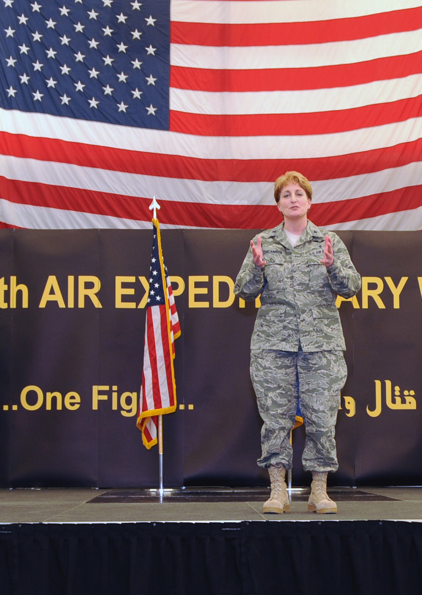 Col. Kathleen Concannon, commander of the 380th Expeditionary Medical Group at a non-disclosed location in Southwest Asia, talks to the audience after taking command of the group on Jan. 4, 2009. Colonel Concannon is deployed from the 319th Medical Group at Grand Forks Air Force Base, N.D. As the commander of the 380th EMDG, she is responsible for health care of more than 2,100 members assigned to the 380th Air Expeditionary Wing and U.S. Embassy personnel. Colonel Concannon also collaborates with host nation clinical facilities and hospitals for emergency, inpatient and outpatient medical and dental care. (U.S. Air Force Photo/Senior Airman Jennifer Calhoun/Released)