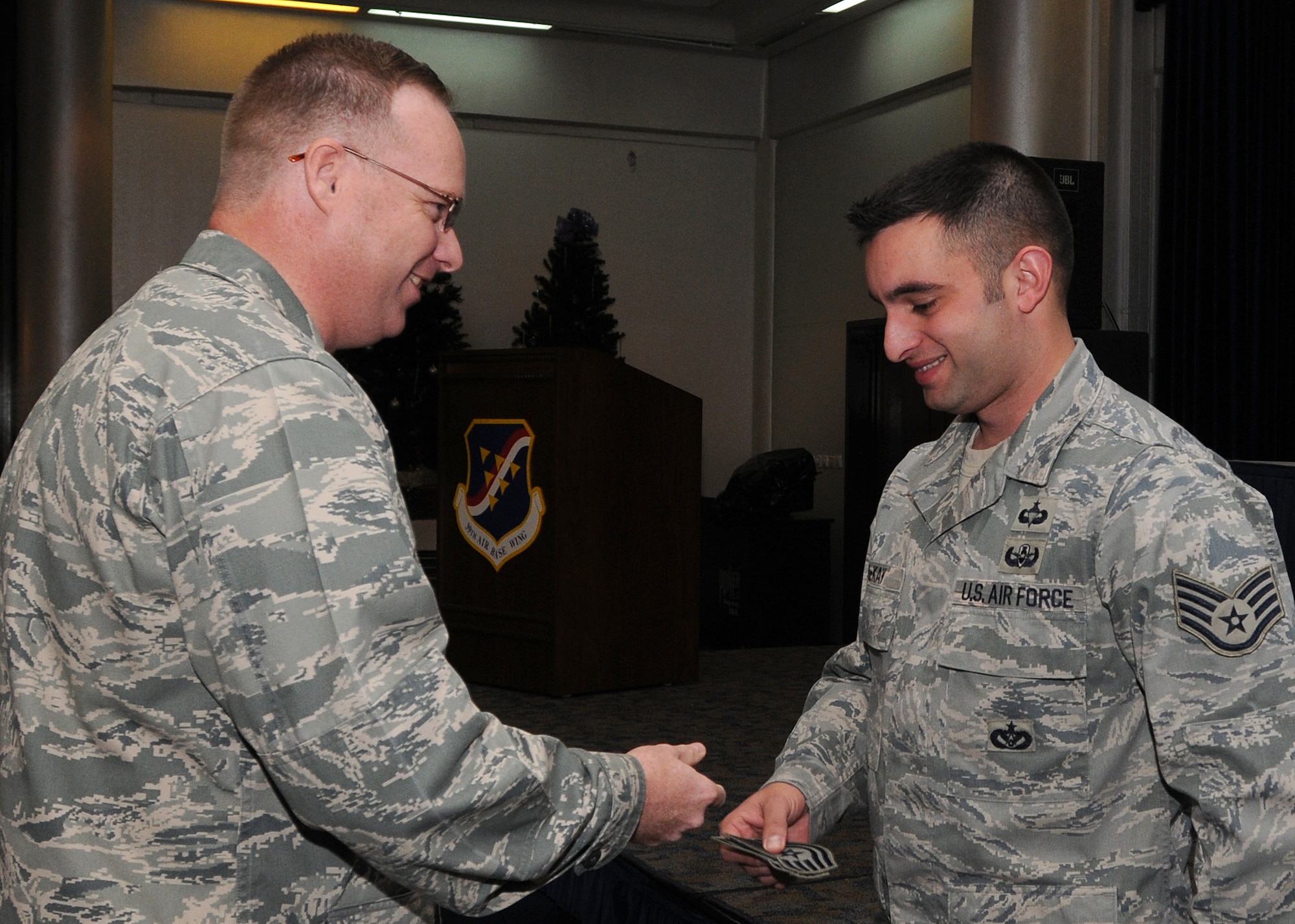 Staff Sgt. Christian McKay, explosive ordinance disposal technician assigned to the 39th Civil Engineer Squadron, receives technical sergeant stripes from Col. Eric Beene, 39th Air Base Wing commander, after being promoted through the Stripes for Exceptional Performers program Wednesday, Jan. 6, 2010 during a commander’s call at Incirlik’s Consolidated Club.  STEP is an incentive program that identifies outstanding senior airmen, staff and technical sergeants and is based on the Airman’s professional accomplishments and recommendations from their commander. (U.S Air Force Photo/Senior Airman Ashley Wood)