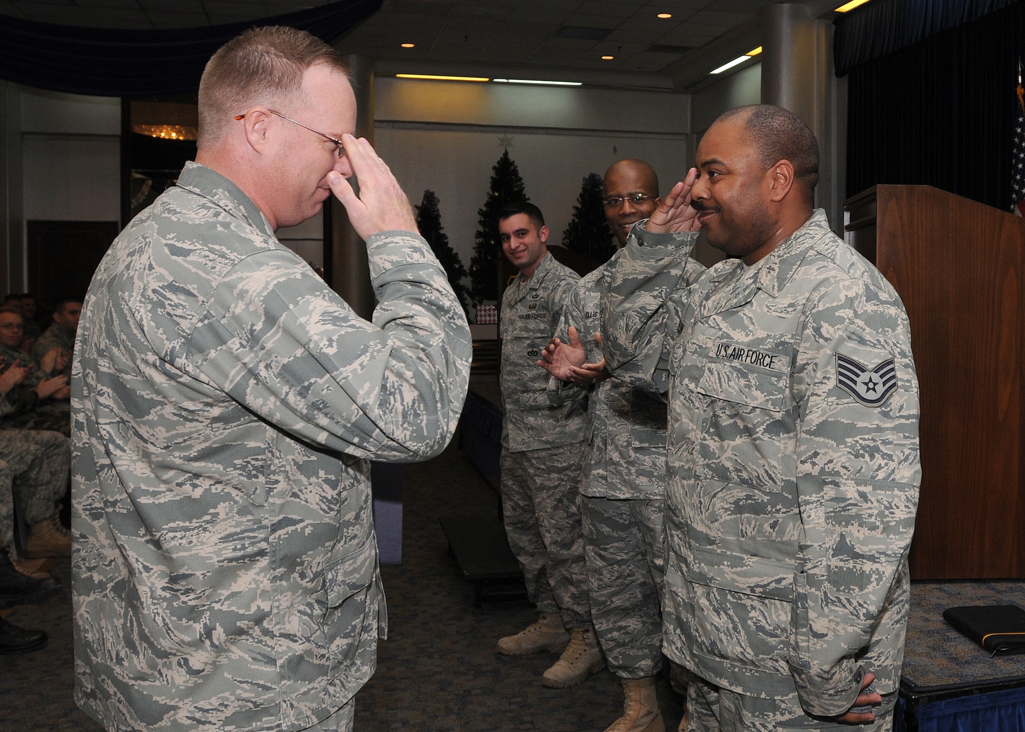 Staff Sgt. Dewayne Wilson, 39th Communications Squadron, salutes Col. Eric Beene, 39th Air Base Wing commander, after being promoted to technical sergeant through the Stripes for Exceptional Performers program Wednesday, Jan. 6, 2010 during a commander’s call at Incirlik’s Consolidated Club.  STEP is an incentive program that identifies outstanding senior airmen, staff and technical sergeants and is based on the Airman’s professional accomplishments and recommendations from their commander. (U.S Air Force Photo/Senior Airman Ashley Wood)