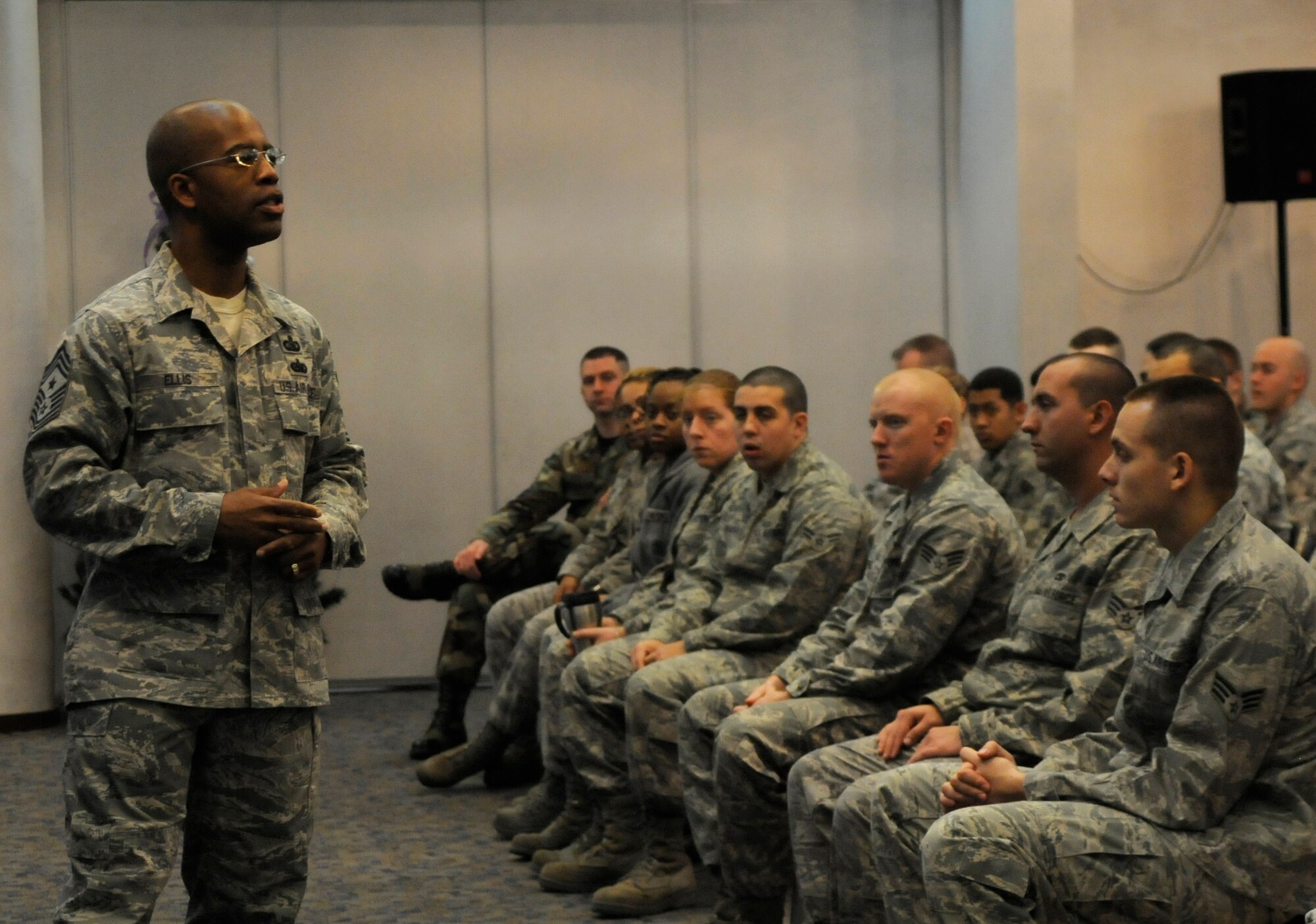 Chief Master Sgt. Robert Ellis, 39th Air Base Wing command chief, speaks to Incirlik Airmen Wednesday, Jan. 6, 2010 during the first commander’s call of the New Year. Chief Ellis highlighted the commander’s topics about the updated standards for physical training tests and Air Force uniforms for 2010. (U.S. Air Force photo/Airman 1st Class Amber Ashcraft)