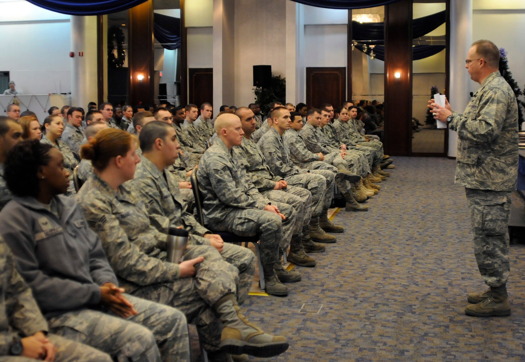 Col. Eric Beene, 39th Air Base Wing commander, speaks to Incirlik Airmen Wednesday, Jan. 6, 2010 during the first commander’s call of the New Year. Colonel Beene spoke of New Year’s resolutions and updated standards for physical training tests and Air Force uniforms for 2010. (U.S. Air Force photo/Airman 1st Class Amber Ashcraft)
