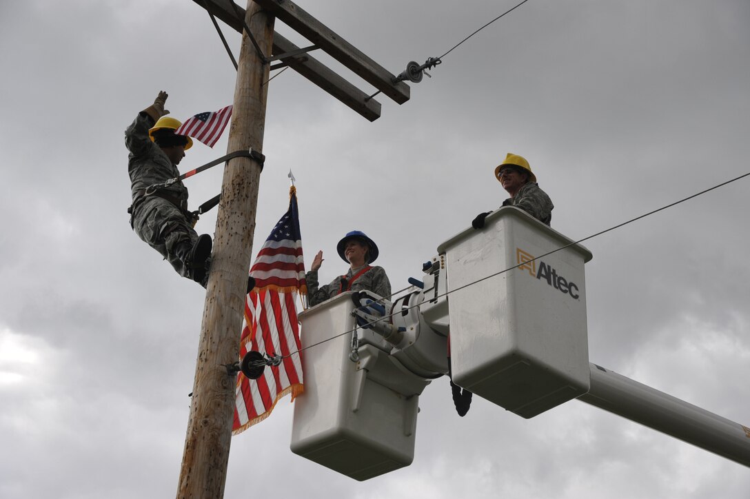 Staff Sgt. Hector Guardado, 932nd Civil Engineer Squadron, reenlists on a pole used for practice at the Air Force Reserve Command unit located in Illinois near the city of Belleville. (U.S. Air Force photo/Tech. Sgt. Gerald Sonnenberg)