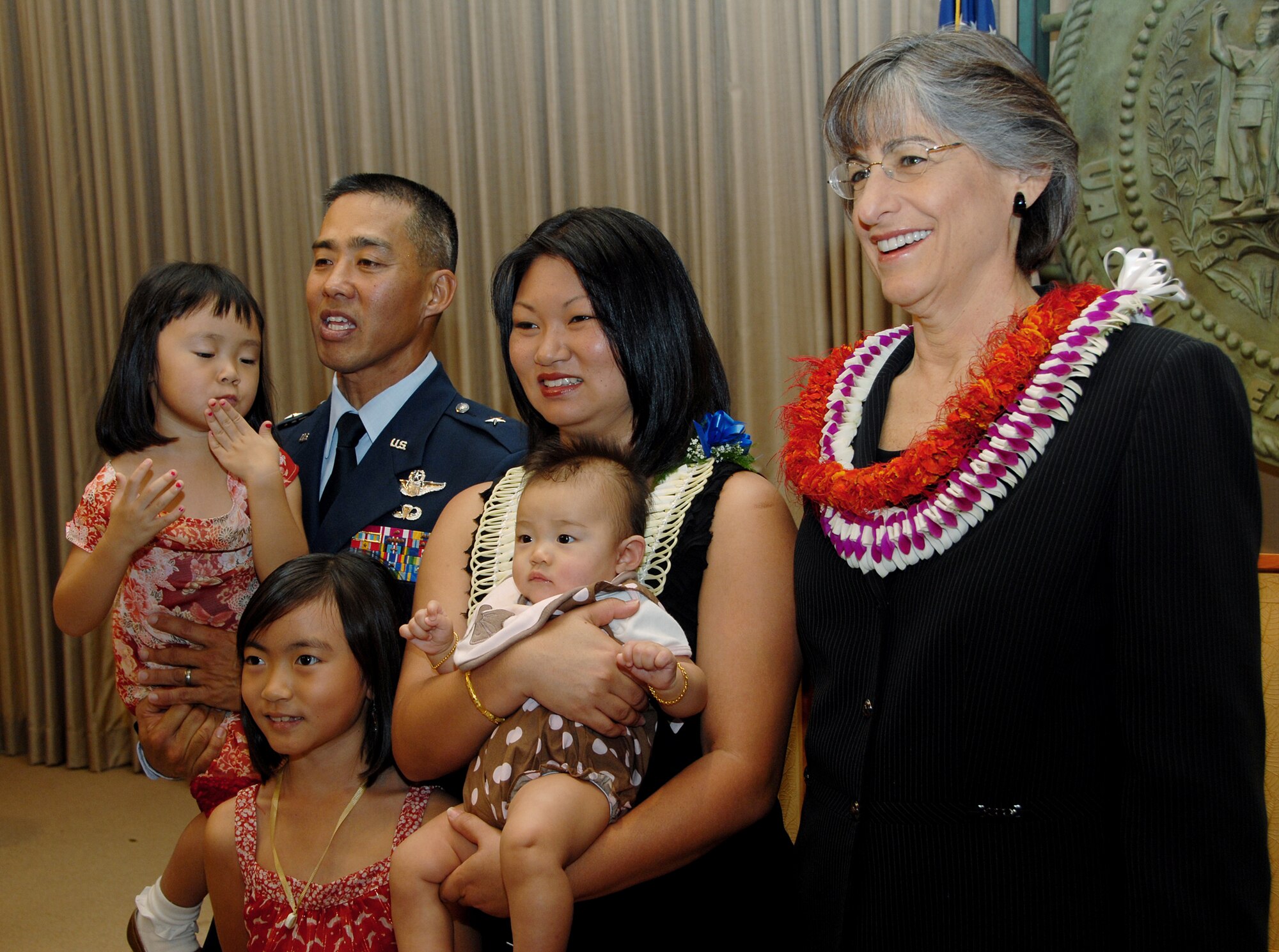 Hawaii Gov. Linda Lingle, poses with newly pinned Brig. Gen. Joseph K. Kim and his family following pinning ceremony at the state Capitol, Jan. 8.  (U.S. Air Force photo/Tech. Sgt. Betty J. Squatrito-Martin