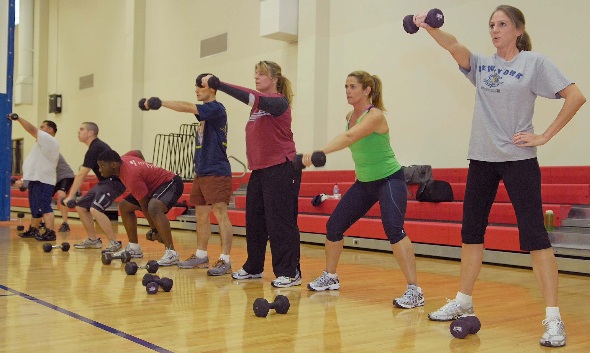 VANDENBERG AIR FORCE BASE, Calif. -- Putting their muscles to work, a group of attendees at the Hardcore 30-Minute Workout, do arm raises with various hand weights here Wednesday, Jan. 6, 2010. The workout program is provided at the base fitness center at lunchtime from noon to 12:30 p.m. (U.S. Air Force photo/Airman 1st Class Andrew Lee)

 