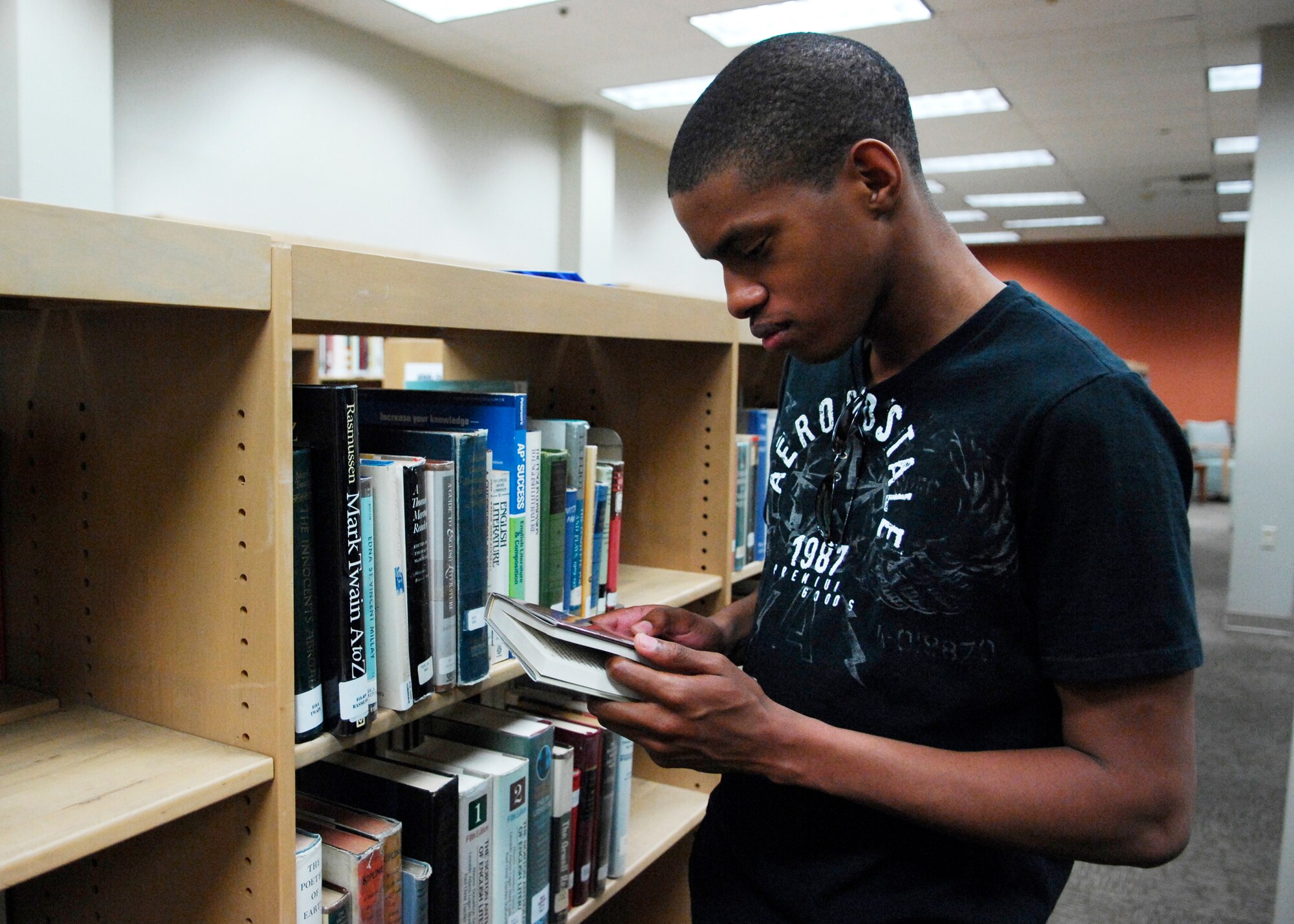 VANDENBERG AIR FORCE BASE, Calif. -- Looking for a book to study, Airman 1st Class James Simonton, from the 30th Security Forces Squadron, browses the new book shelves at the library here Thursday, Jan. 7, 2010. The library celebrated its grand re-opening Wednesday after more than $300,000 in renovations were completed. (U.S. Air Force photo/Airman 1st Class Heather R. Shaw)







