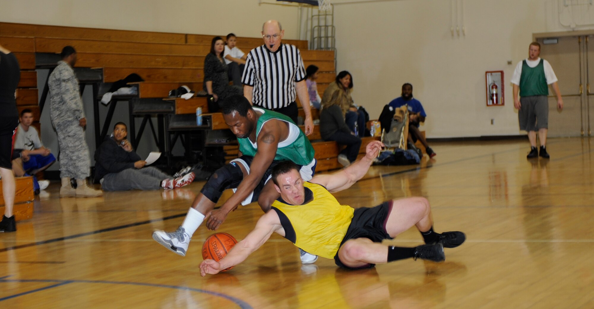 MOUNTAIN HOME AIR FORCE BASE, Idaho-- Trey Hatchett, security forces squadron small forward and Kirk Peiffer, civil engineer squadron shooting guard, drive for a loose ball during an intramural basketball game Jan. 6. SFS went on to win 57-48. (U.S. Air force photo by Airman 1st Class Renishia Richardson)