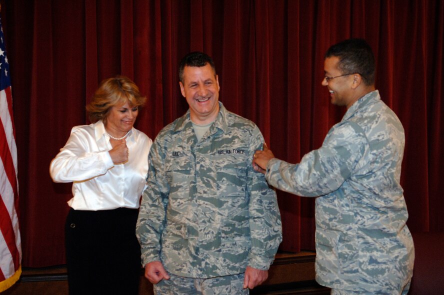 Chief Master Sgt. Bryan Lee is promoted to Chief on Jan. 7, 2010 at the Surf's Edge Enlisted Club at MacDill Air Force Base in Tampa, Fla.  Lee is pinned by his wife Christine and Col Joe N. Wiburn.  (U.S. Air Force Photo/Tech. Sgt. Denise Hauser)