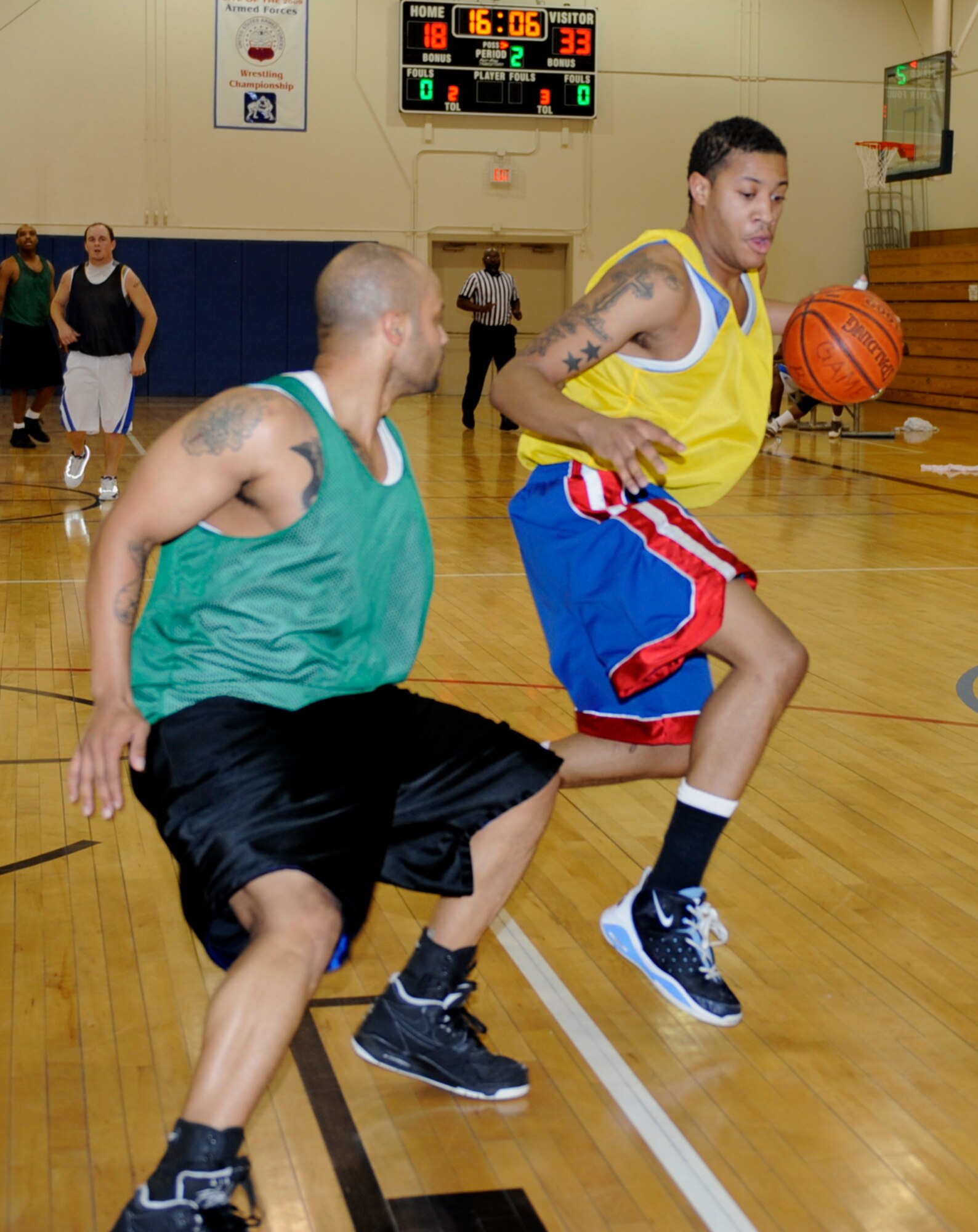 MOUNTAIN HOME AIR FORCE BASE, Idaho-- Adrian Pearson, civil engineer squadron shooting guard, drives to the basket during an intramural basketball against the security forces squadron Jan. 6. SFS went on to win 57-48. (U.S. Air Force photo by Airman 1st Class Renishia Richardson)