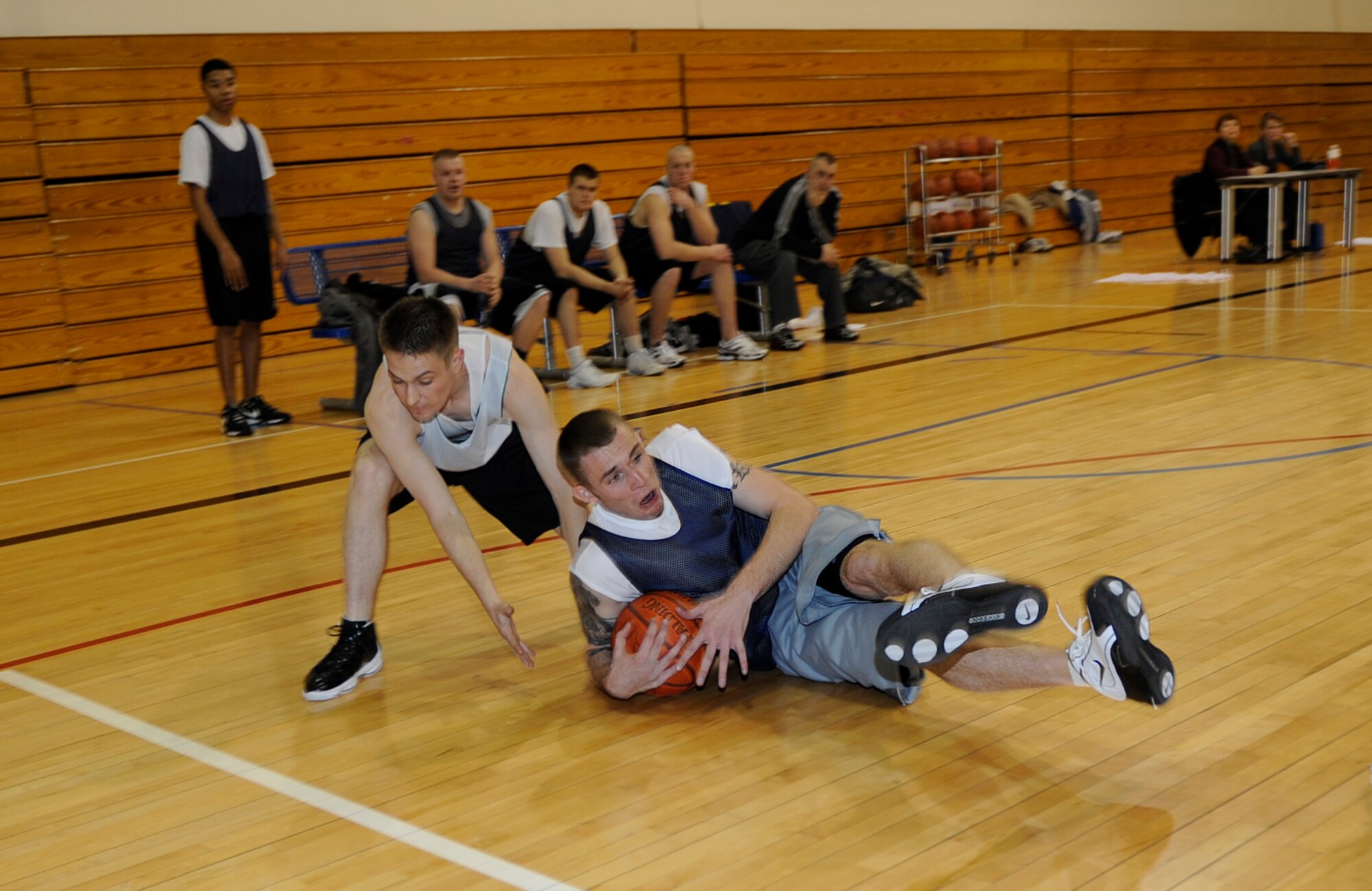 MOUNTAIN HOME AIR FORCE BASE, Idaho-- Jeb Snow, munitions flight power forward, drives for a loose ball during an intramural basketball game against the component maintenance squadron Jan. 6. Ammo went on to win the game 42-32. (U.S. Air Force photo by Airman 1st Class Renishia Richardson)