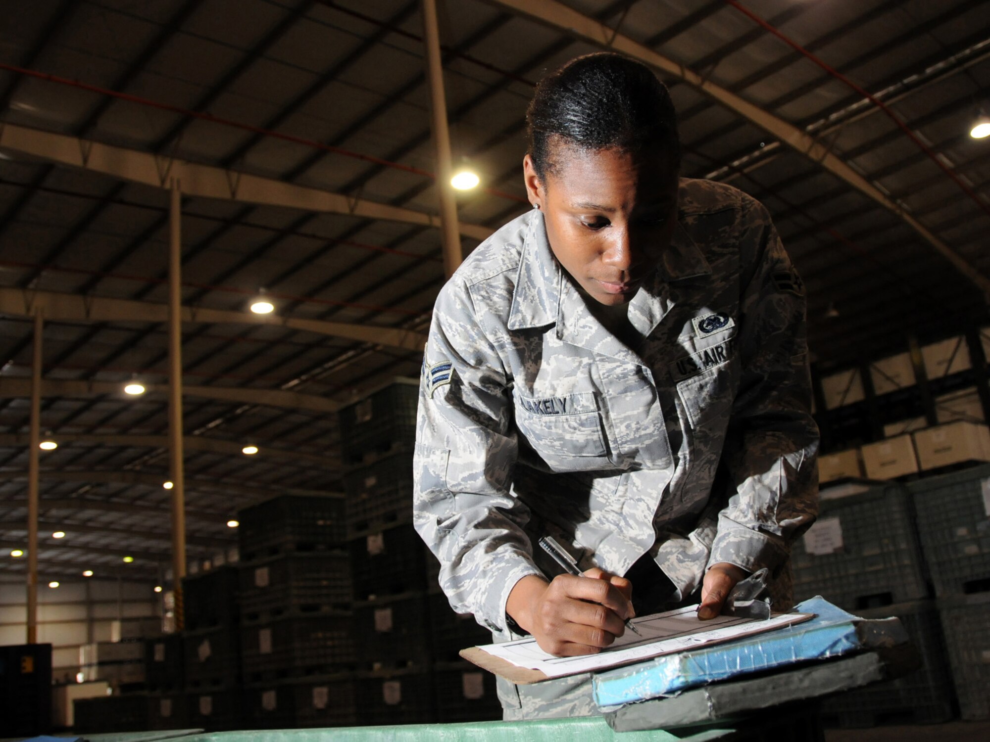 Airman 1st Class Lateshia Blakely takes inventory of individual body armor plates stored at the expeditionary theater distribution center warehouse Oct. 1, 2009 in Southwest Asia. The ETDC warehouse stores mobility equipment to be issued to transient personnel as the deploy to forward bases. Airman Blakely, a 379th Expeditionary Logistics Readiness Squadron readiness technician, is deployed from Dover Air Force Base, Del. (U.S. Air Force Photo/Tech. Sgt. Jason W. Edwards)