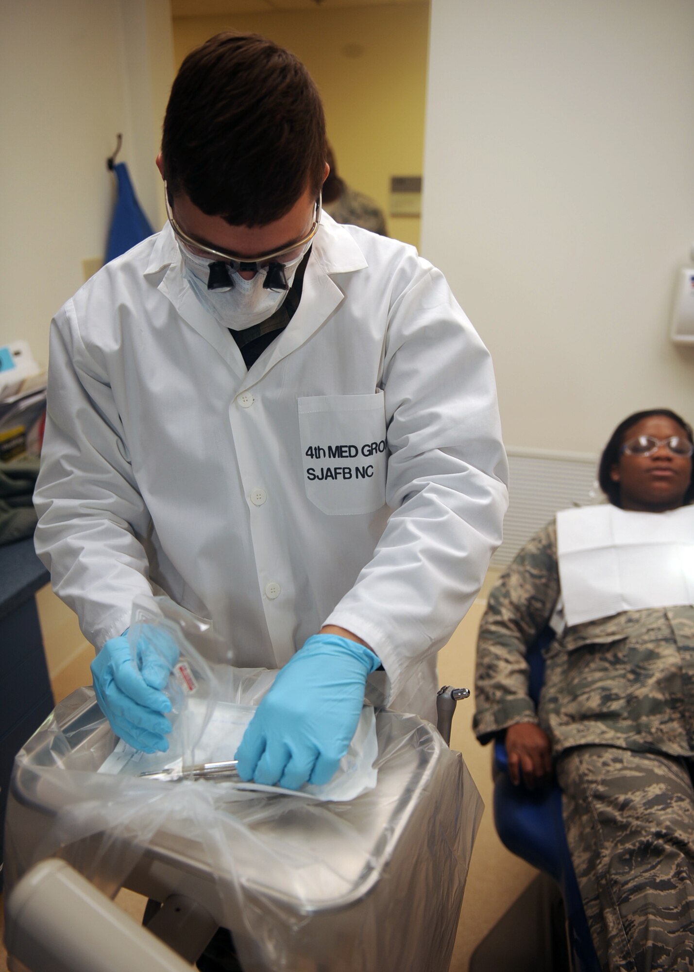 Senior Airman Barry Wood, 4th Aerospace Medicine Squadron dental technician, adjusts a dental unit for a patient during a dental exam on Seymour Johnson Air Force Base, N.C., Jan. 5, 2010. Dental technicians perform routine cleanings and check for abnormalities during annual examinations. Wood hails from Rutherfordton, N.C. (U.S. Air Force photo/Senior Airman Ciara Wymbs) 